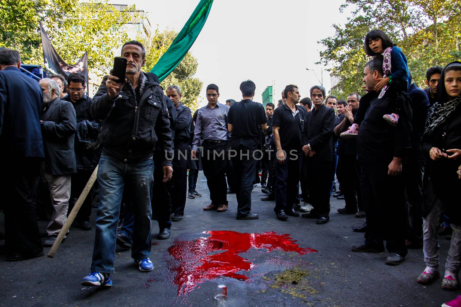 IRAN, Tehran: Iraqis living in Iran gathered to mourn in front of the Grand Bazaar in Tehran, Iran on October 23, 2015.Worshipers in these photos celebrate the Ashura, or tenth day of Muharram. Muharram is the first month in the Islamic calendar and the Ashura marks the day that the grandson of the Prophet Mohammad's grandson, Imam Hussein, was killed. 