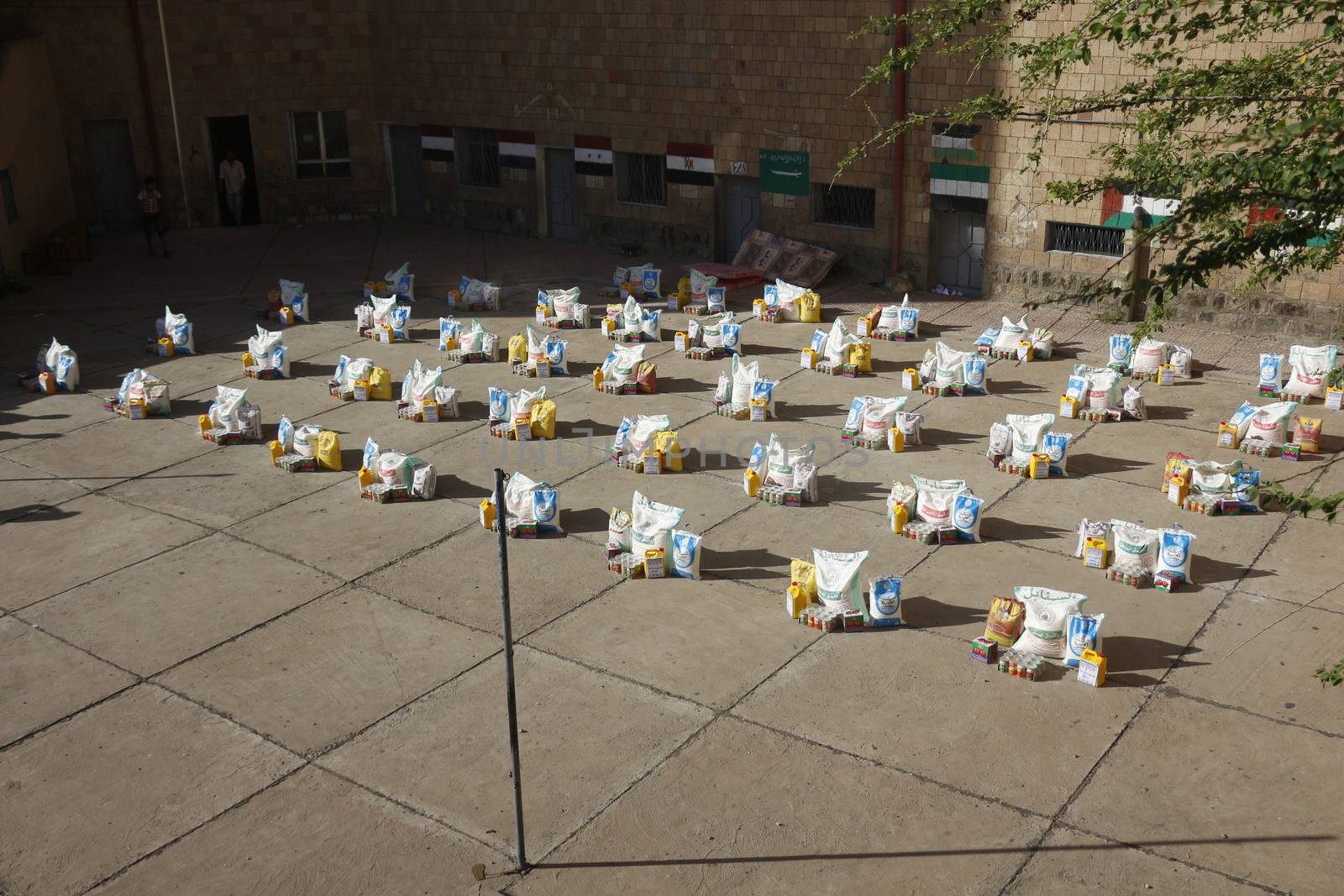YEMEN, Taiz: A distribution of food and clean water is pictured in the Nasser school, outside Taiz (Ta'izz), western Yemen, on October 23, 2015. Many Yemenis are suffering from lack of basic services and resources, in a humanitarian disaster dramatically worsened by a blockade imposed by the Saudi-led coalition.