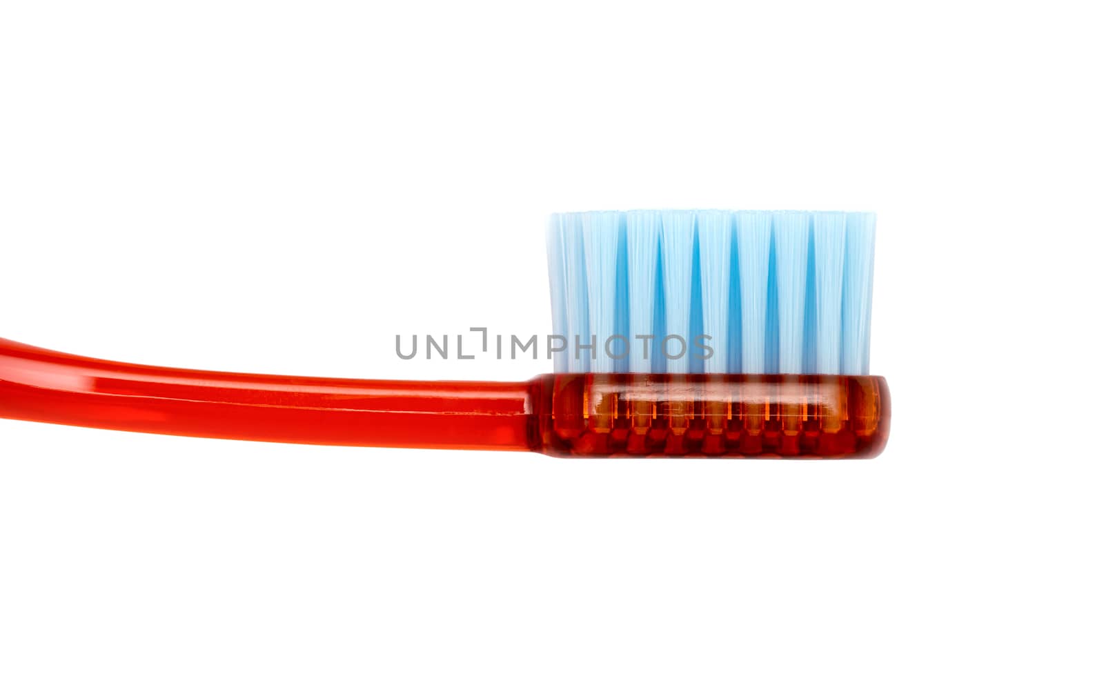 Red toothbrush isolated on a white background by DNKSTUDIO