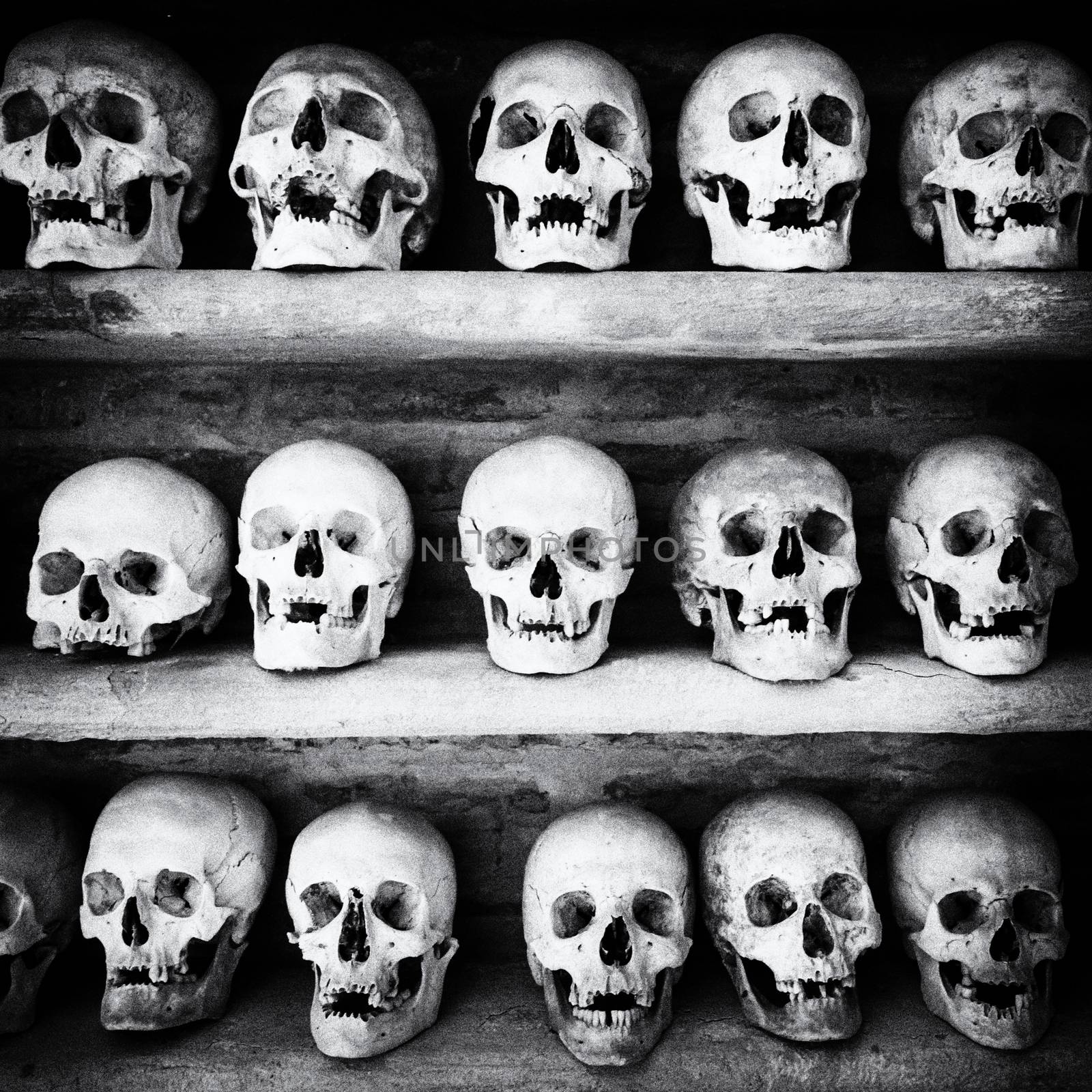 Human skulls inside a catacomb. by Isaac74