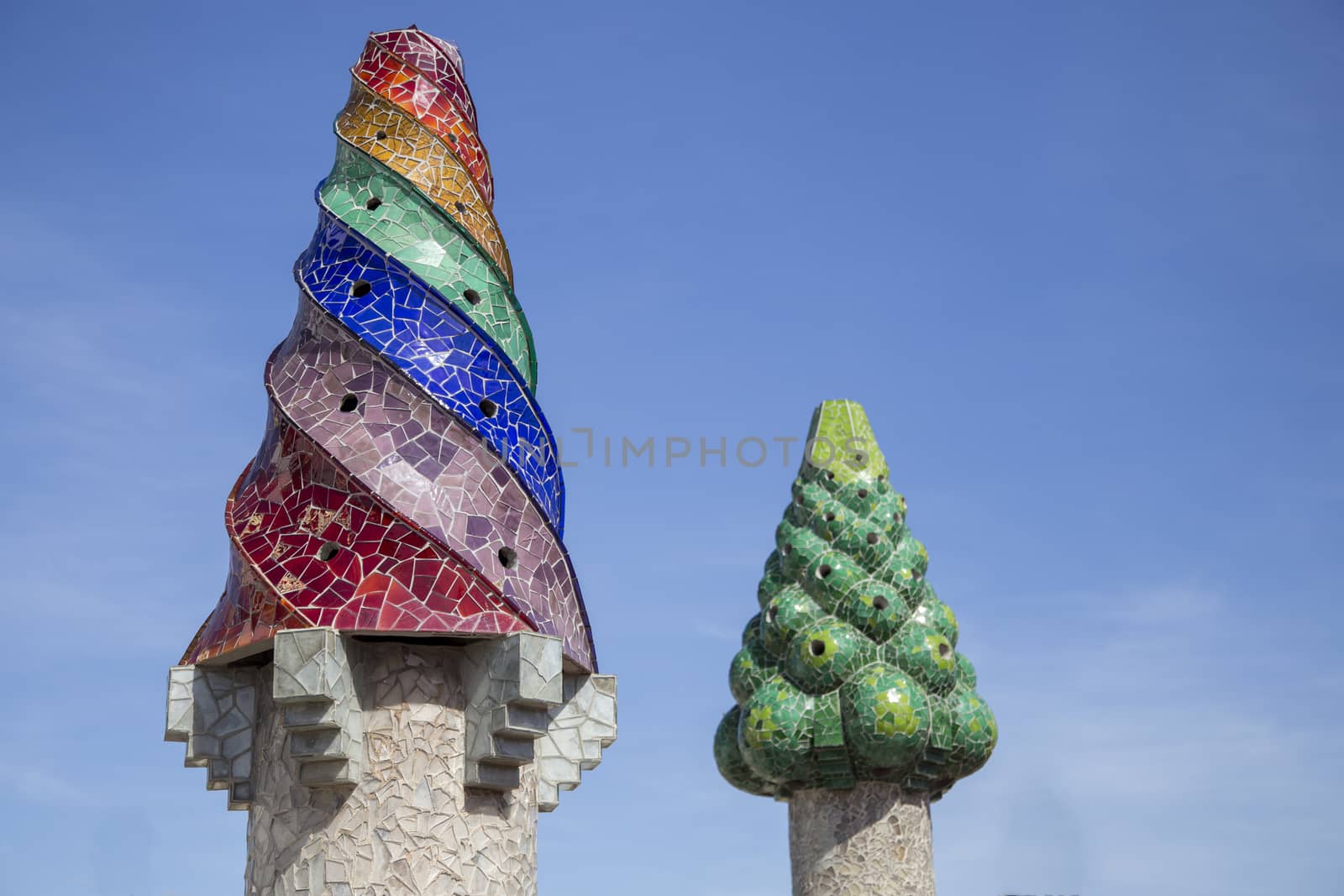 Barcelona, Spain - September 25, 2015: Gaudi Chimney, Palau Guell, Gaudi broken tile mosacis and strange decorated chimneys are evident in his early work at Palau Guell.