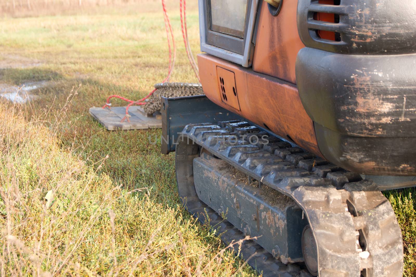 The crawler excavator operator stopped by the lake.