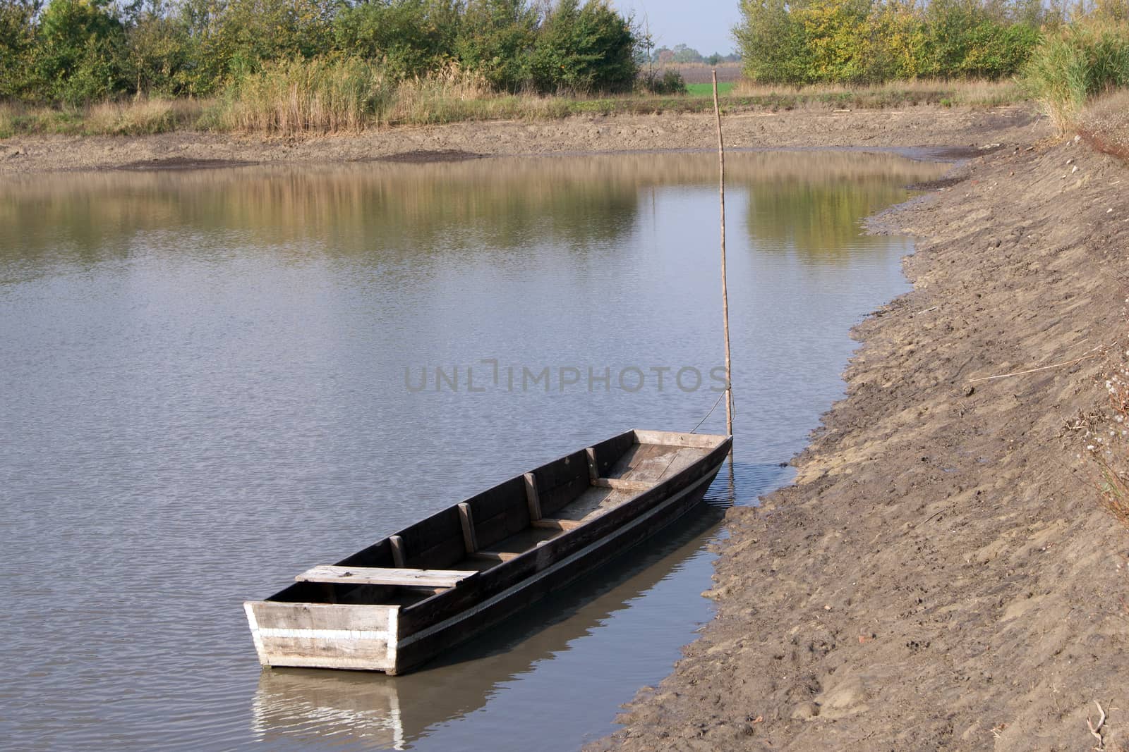 The fishermen's boat waits near the shoreline.