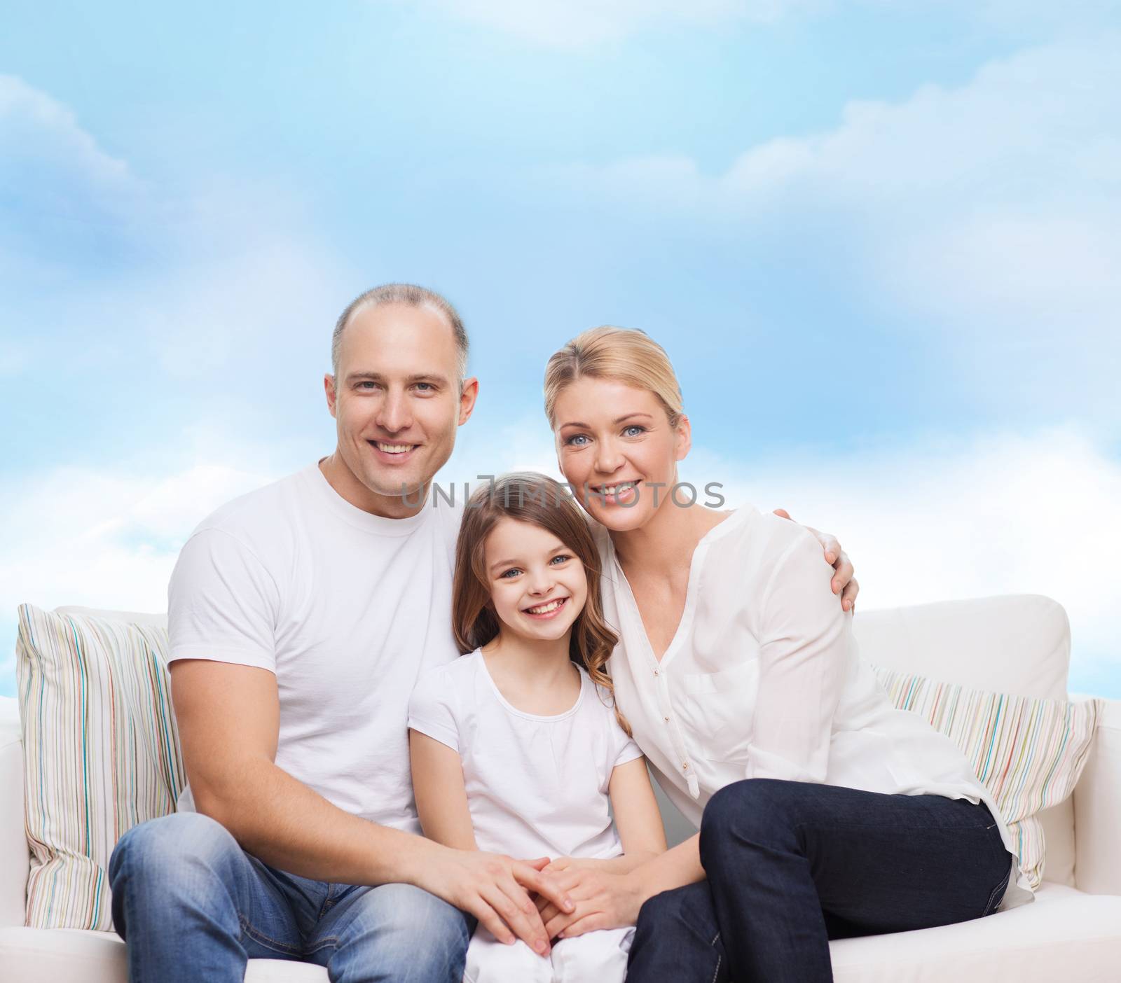 family, childhood and people concept - smiling mother, father and little girl over blue sky background