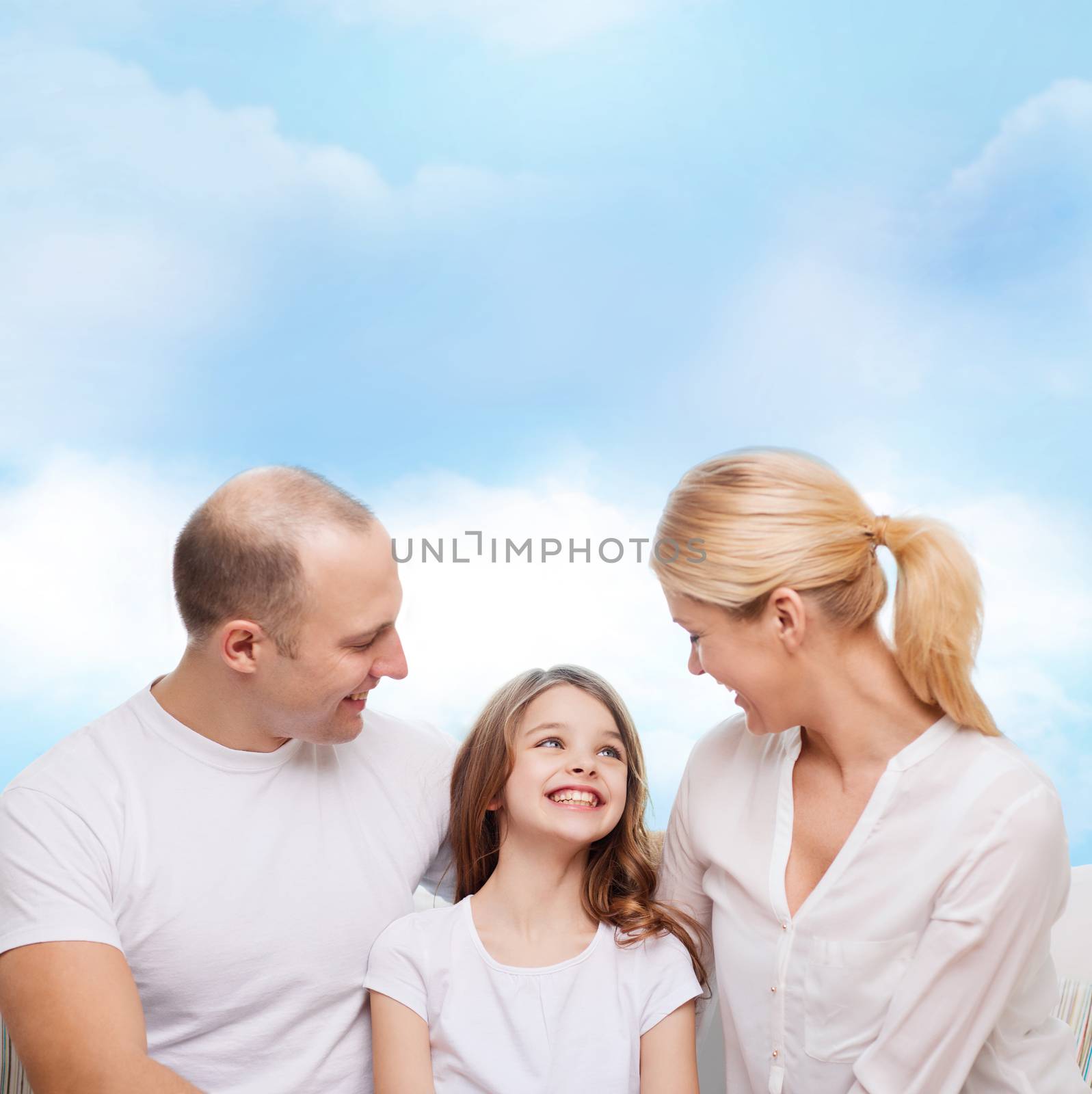 family, childhood and people - smiling mother, father and little girl over blue sky background