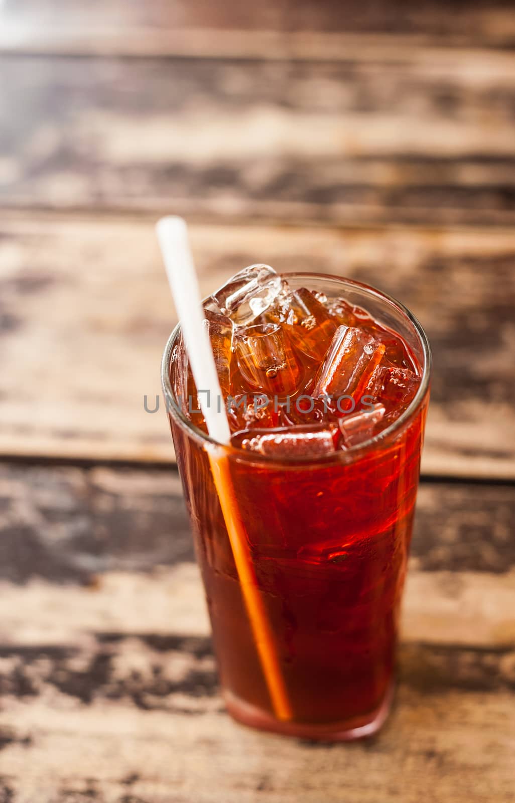 Fresh cold tea with lime on a wooden surface