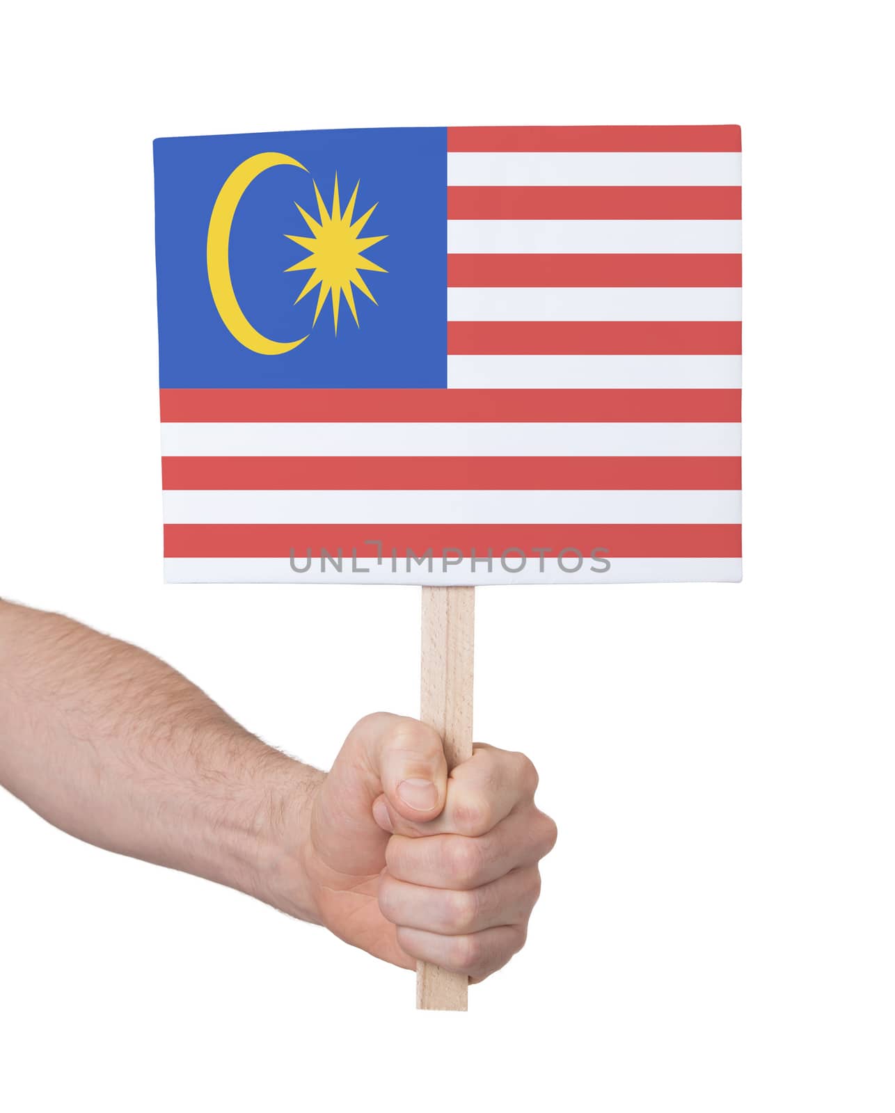 Hand holding small card, isolated on white - Flag of Malaysia