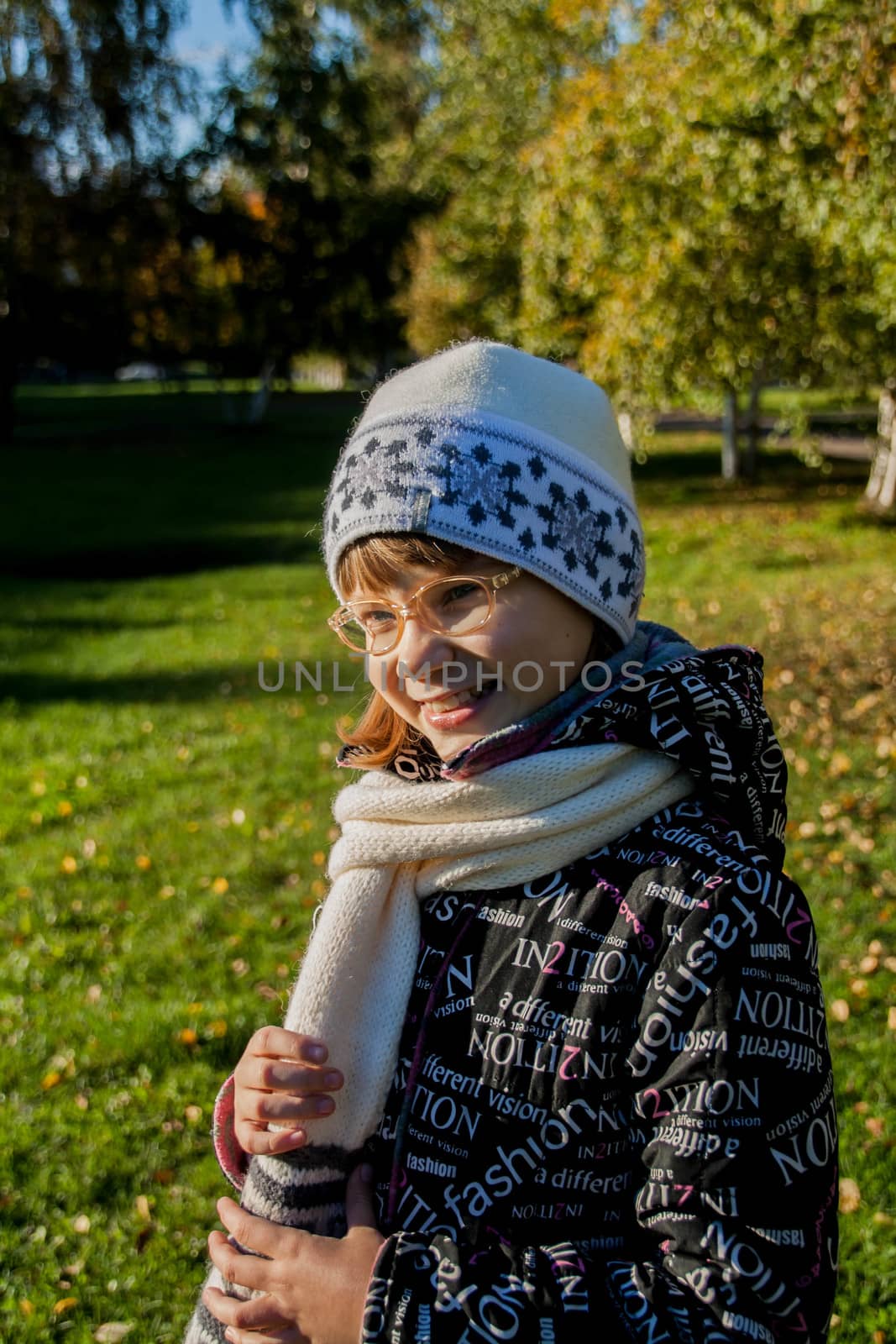 Young woman wearing glasses smiling in the fall