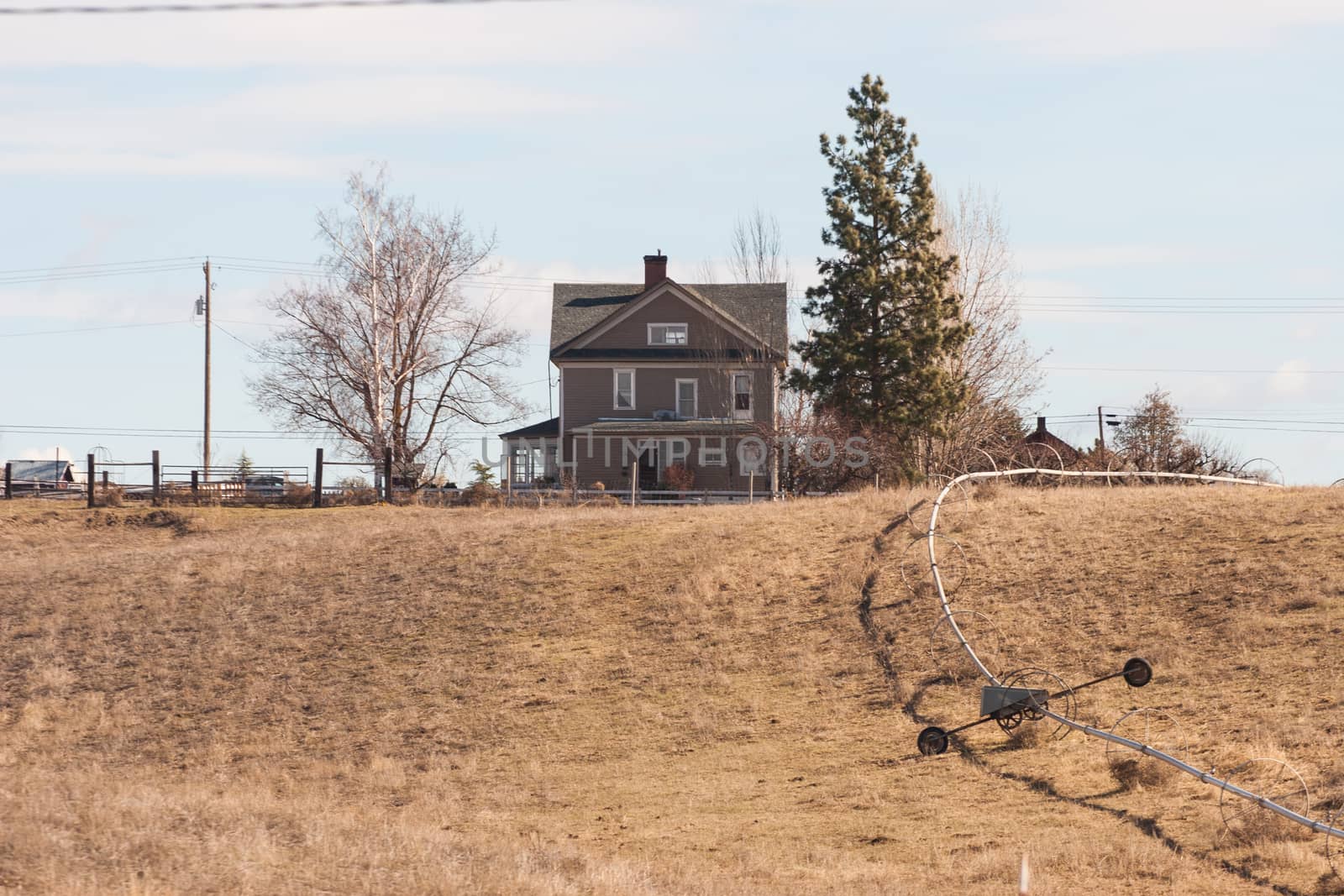 Farm house on a hill by johnborda