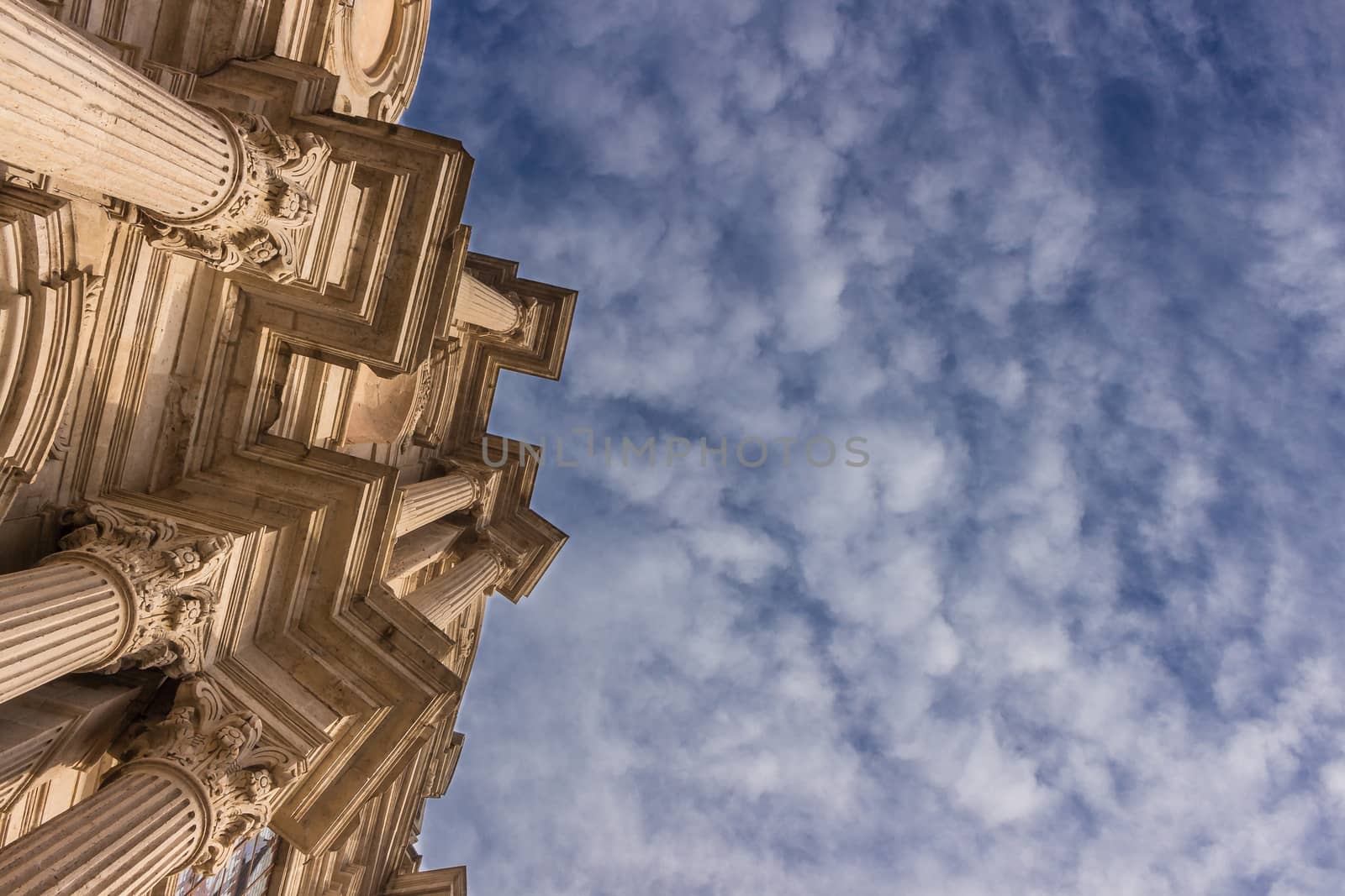 Detail of a italian baroque church on blue sky