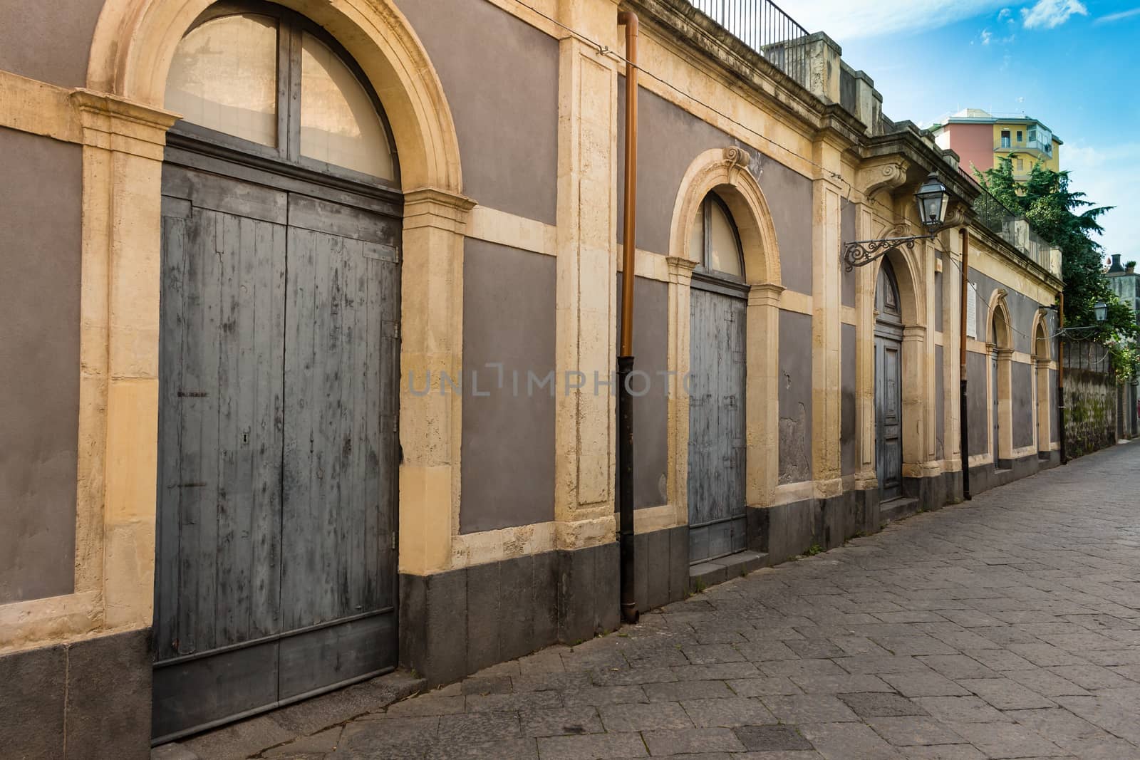 Italy: street with a sicilian old warehouse