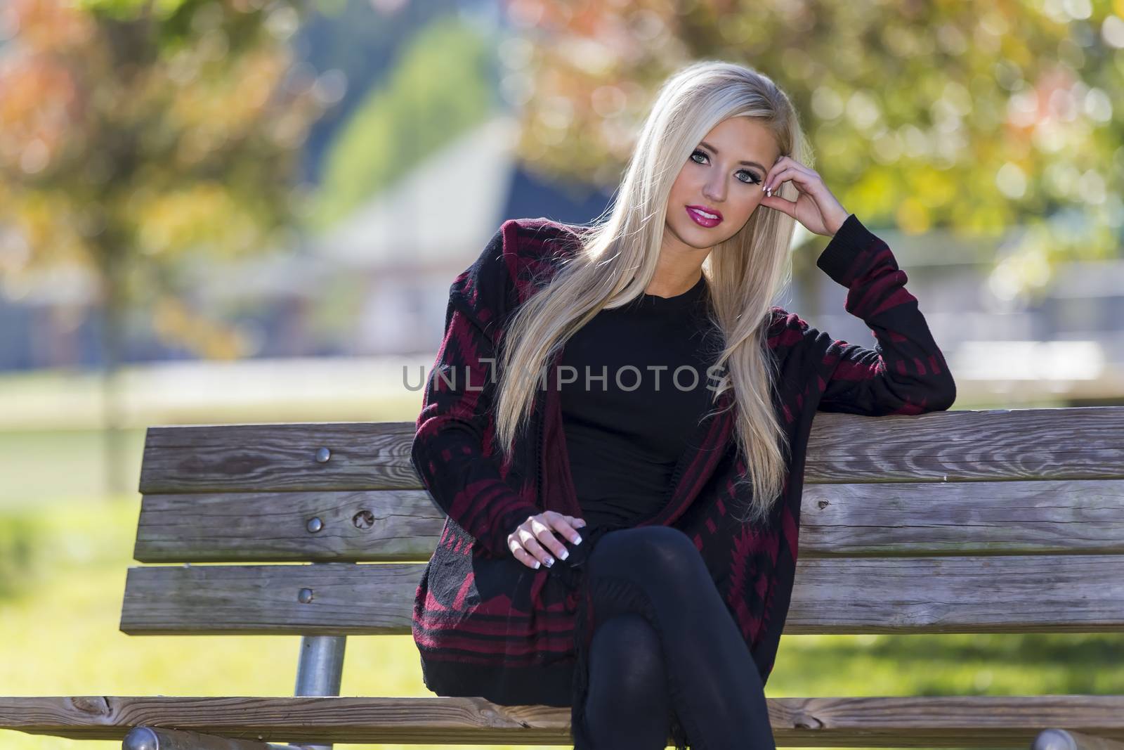 A blonde model posing in an outdoor environment