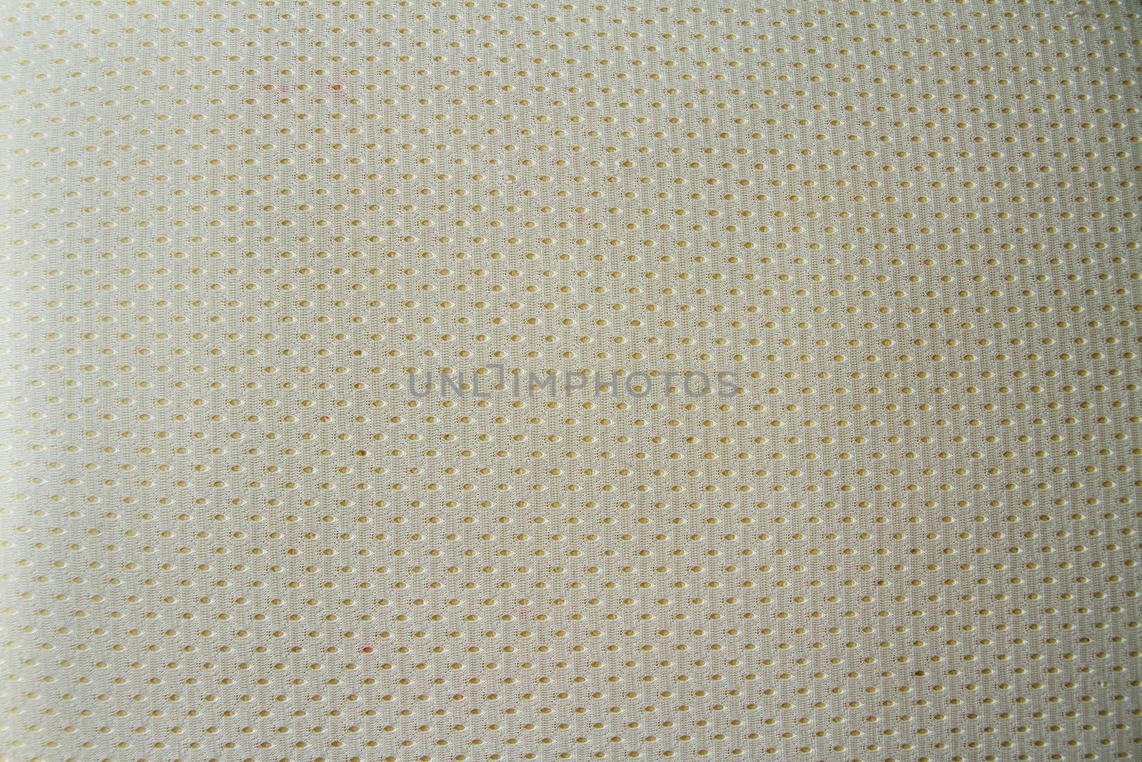 A textured fabric that has holes in it