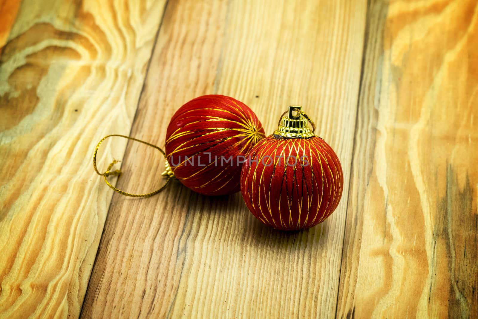 Christmas card with fir and decor on wood floor by teerawit