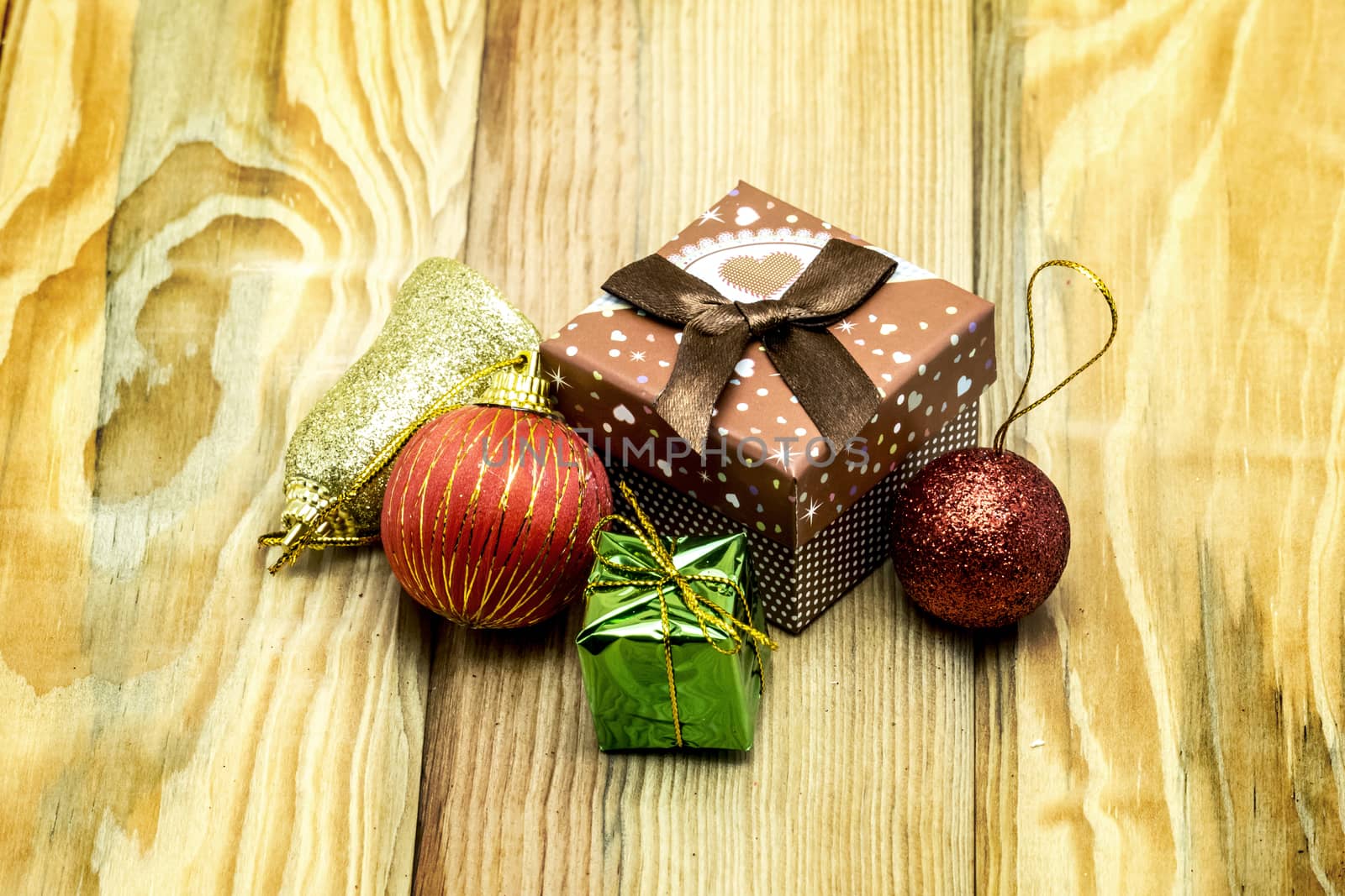 Christmas card with fir and decor on wood floor by teerawit