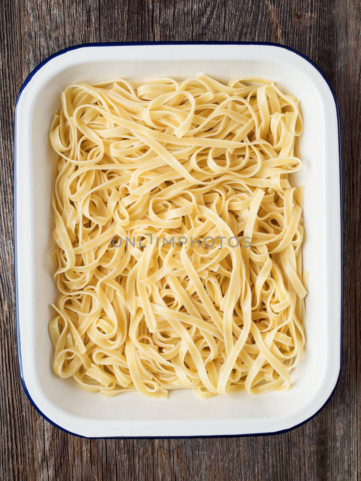 close up of rustic cooked italian fettuccine pasta