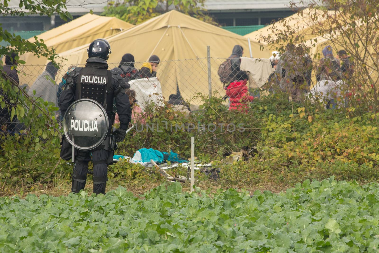 SLOVENIA, Brezice: Migrants traveling along the so-called Balkan migrant route take refuge in the small town of Brezice near the Croatian border on October 21, 2015.  Thousands have surged into the country daily from Croatia in the past weeks. In Brezice nearly 60,000 people have attempted to stay in camps since mid-October. 