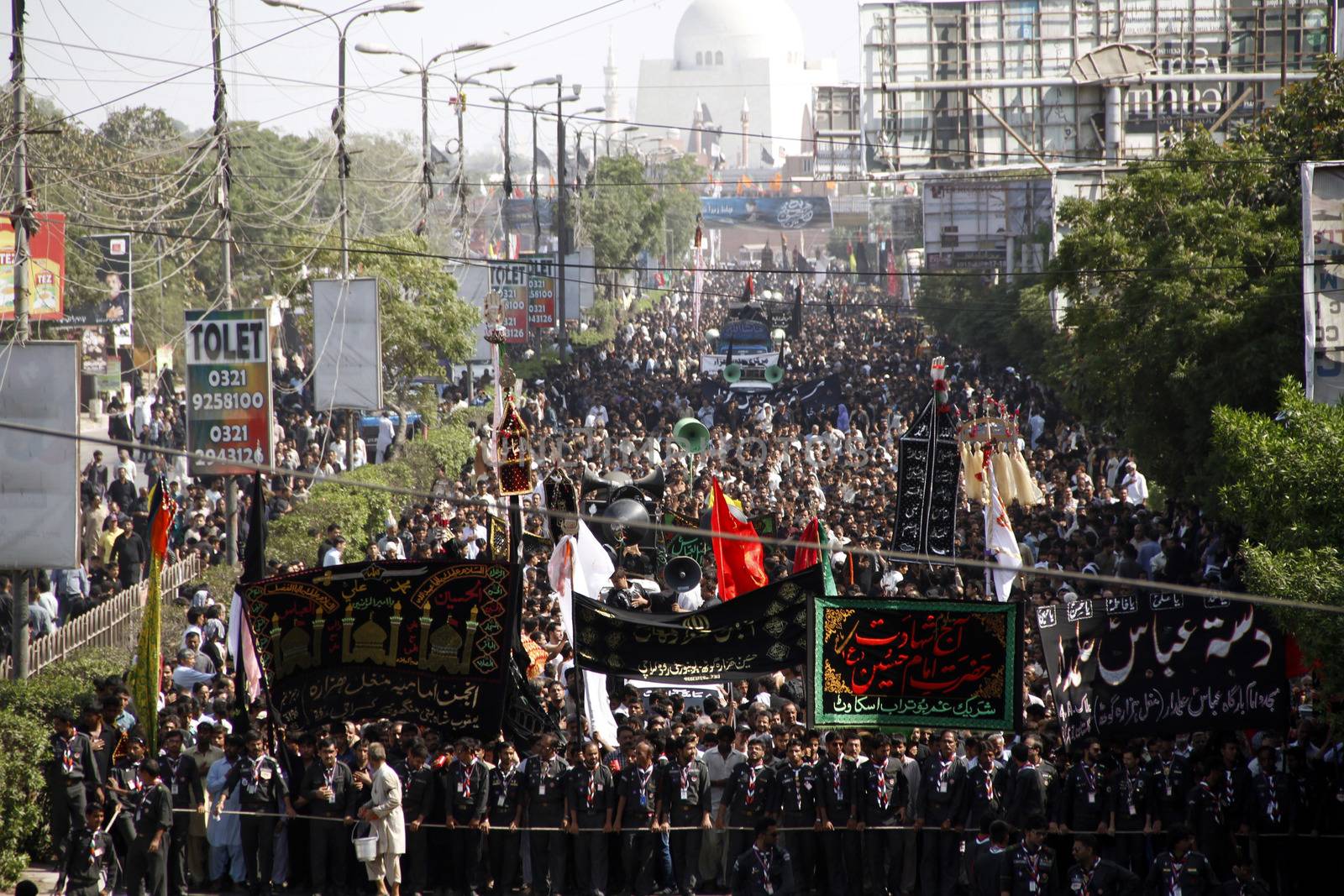 PAKISTAN, Karachi : Shiite Muslims pray during a Ashura procession to commemorate the martyrdom of Imam Hussain, the grandson of Prophet Muhammad, in Karachi on October 24, 2015. The Islamic month of Muharram marks the seven-century martyrdom of Prophet Mohammad's grandson Imam Hussein who was killed in battle in Karbala in Iraq 680 AD. 