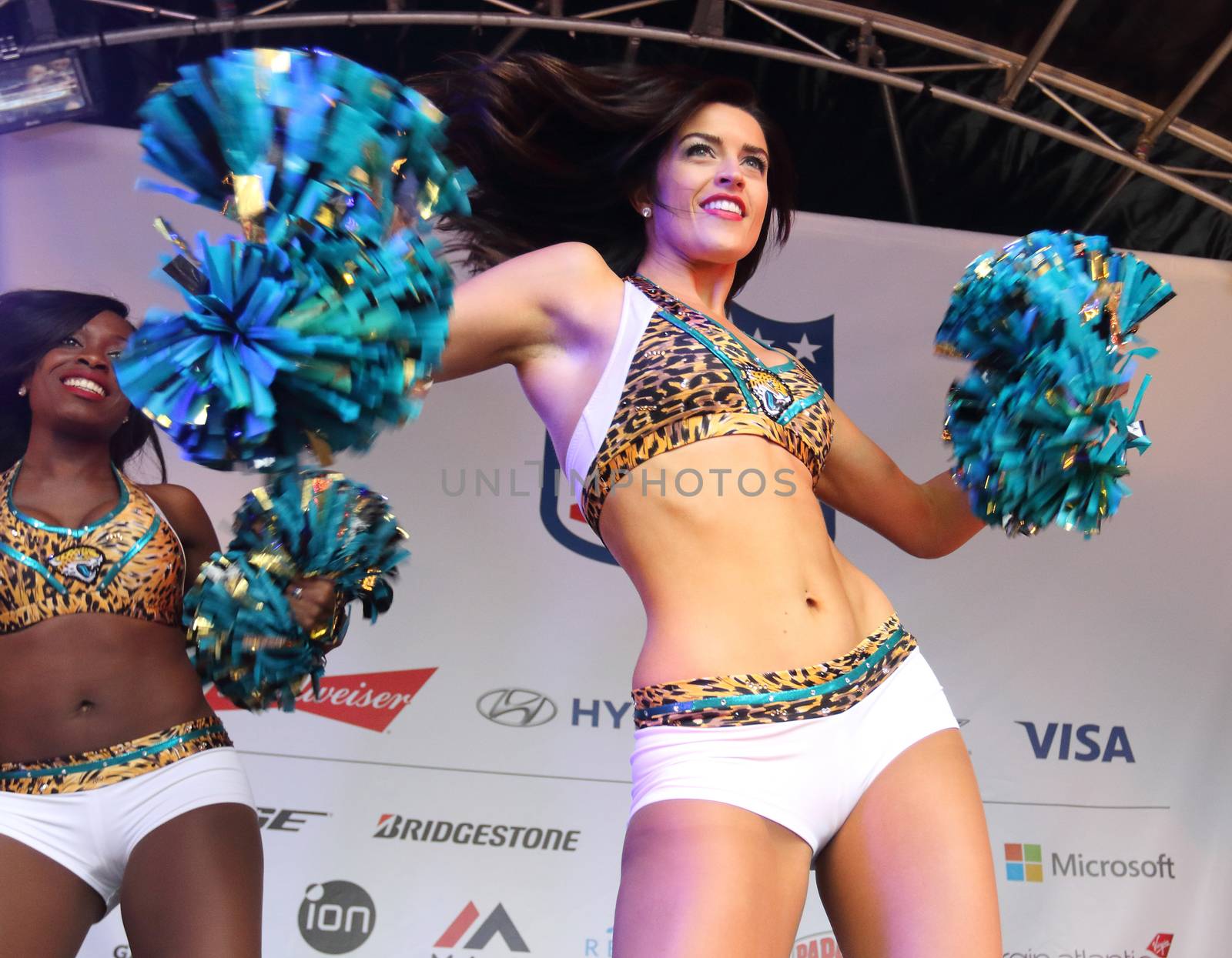 UNITED KINGDOM, London: Cheerleaders perform for thousands of fans at the American football festivities on October 24, 2015 before the regular-season NFL game between the Bills and the Jaguars is played at Wembley Stadium.  The NFL has been holding regular-season games in London since 2007, typically including an 'NFL on Regent Street' event the day before the game. 