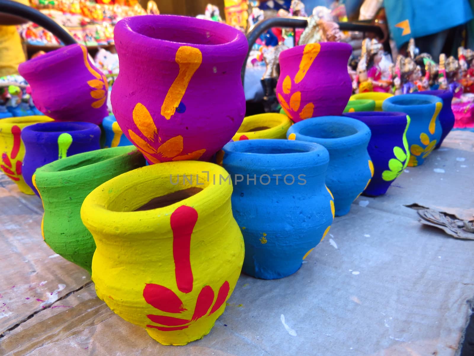 Colorful traditional pots used for rituals and pujas during the Diwali festival in India.                               
