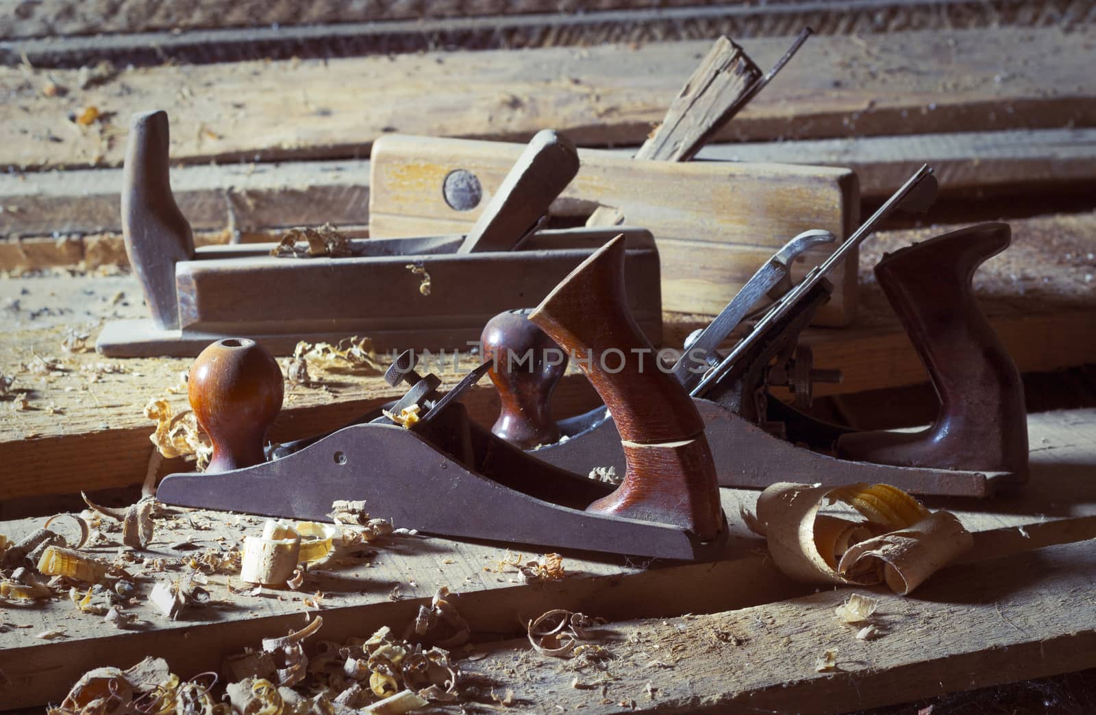 Old wood planes on wooden planks