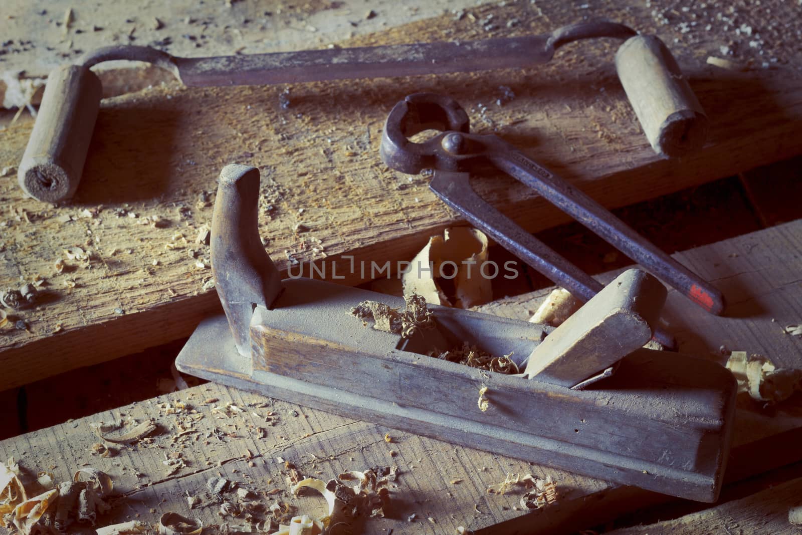 Old carpenter's tools on wooden boards