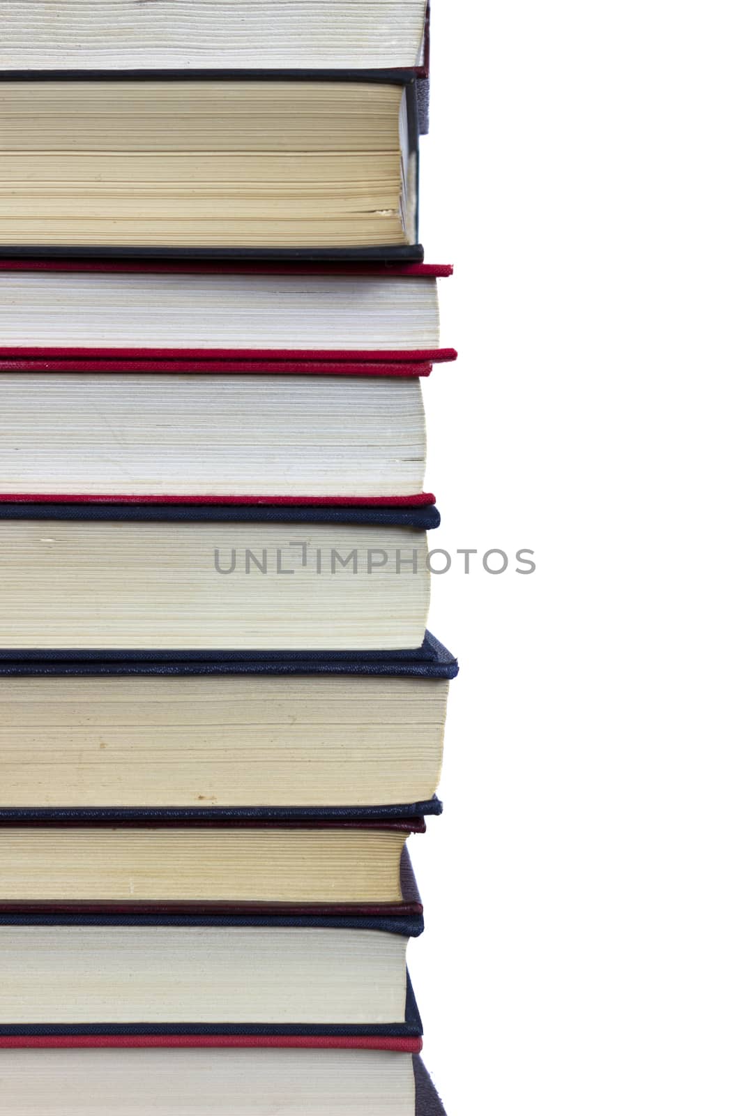 Stack of books on white background, partial view