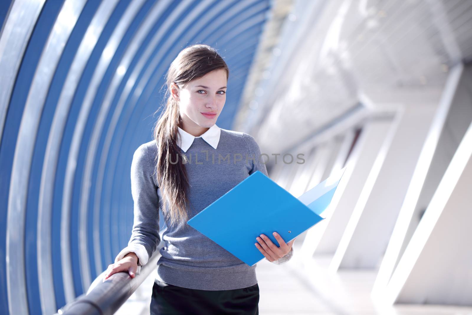 Businesswoman with folder by ALotOfPeople
