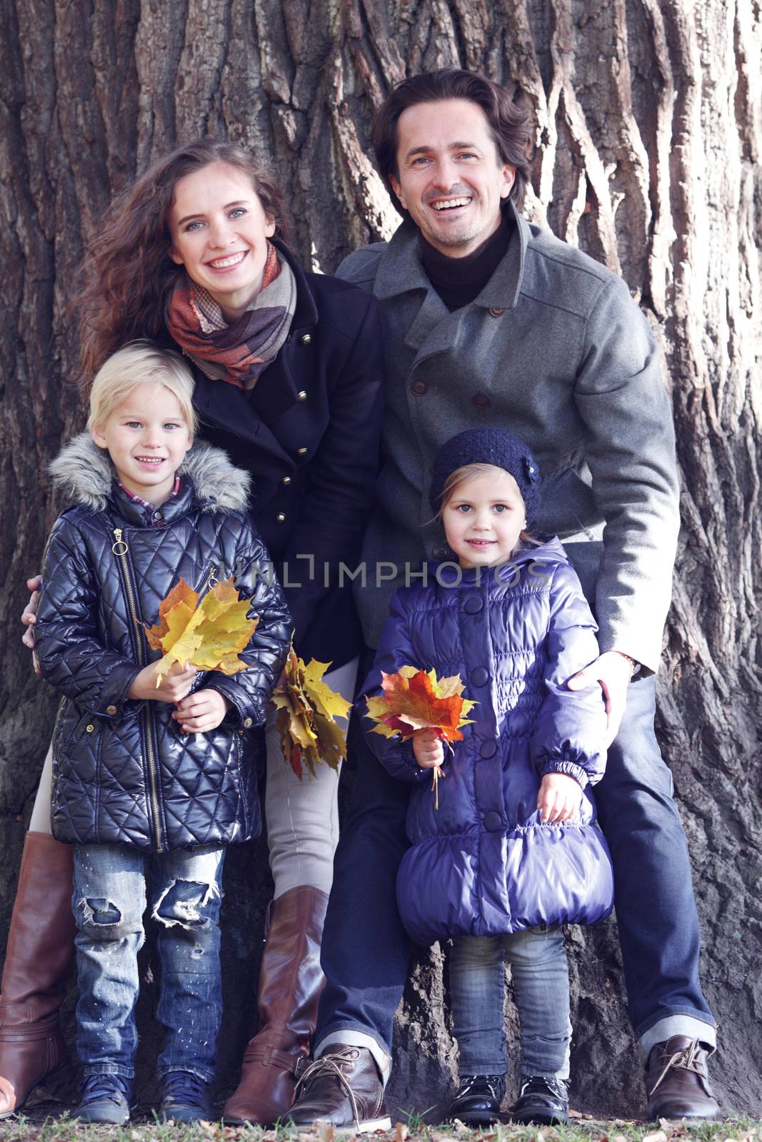 Family near big tree by ALotOfPeople