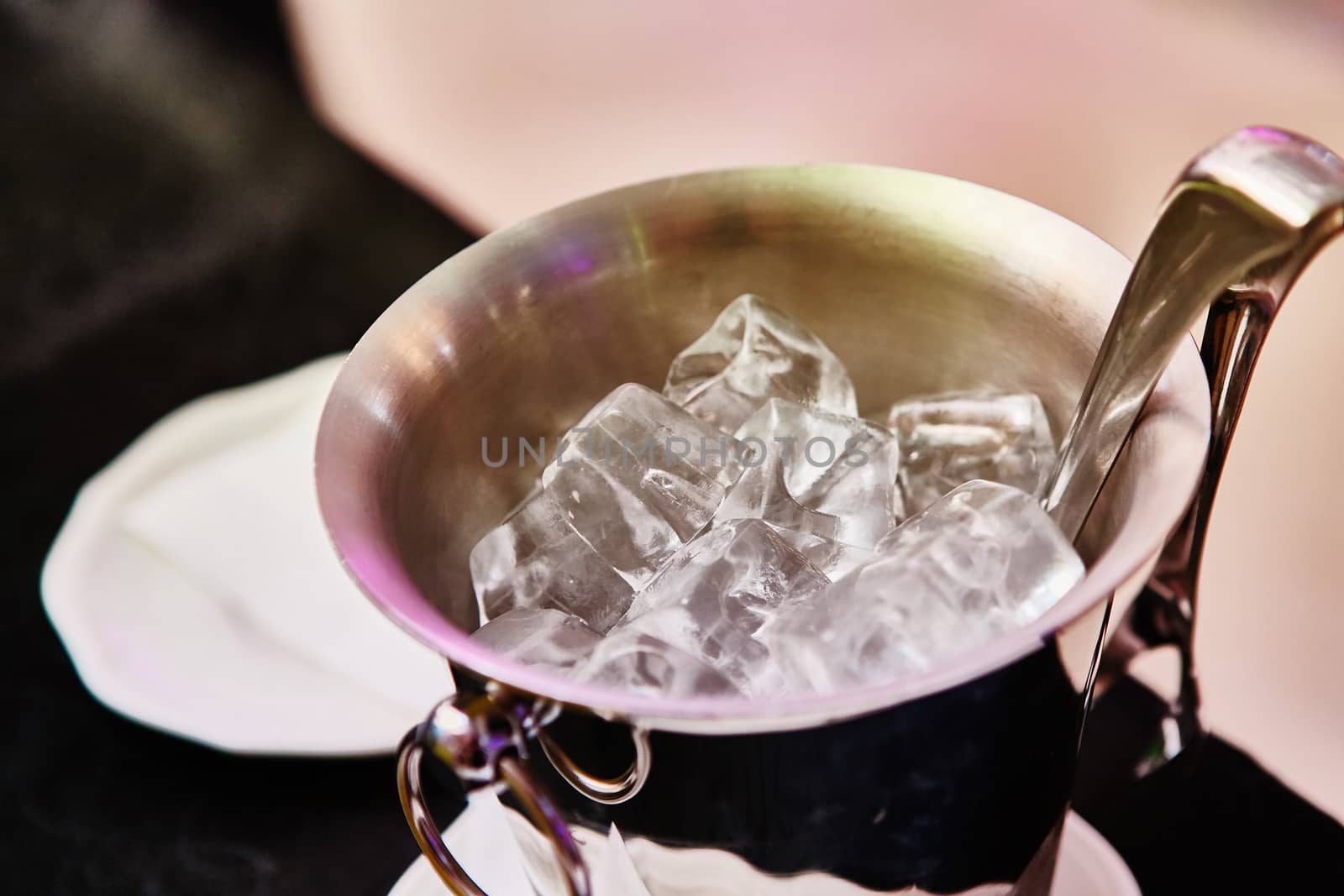 Close up ice in metal bucket in the restaurant