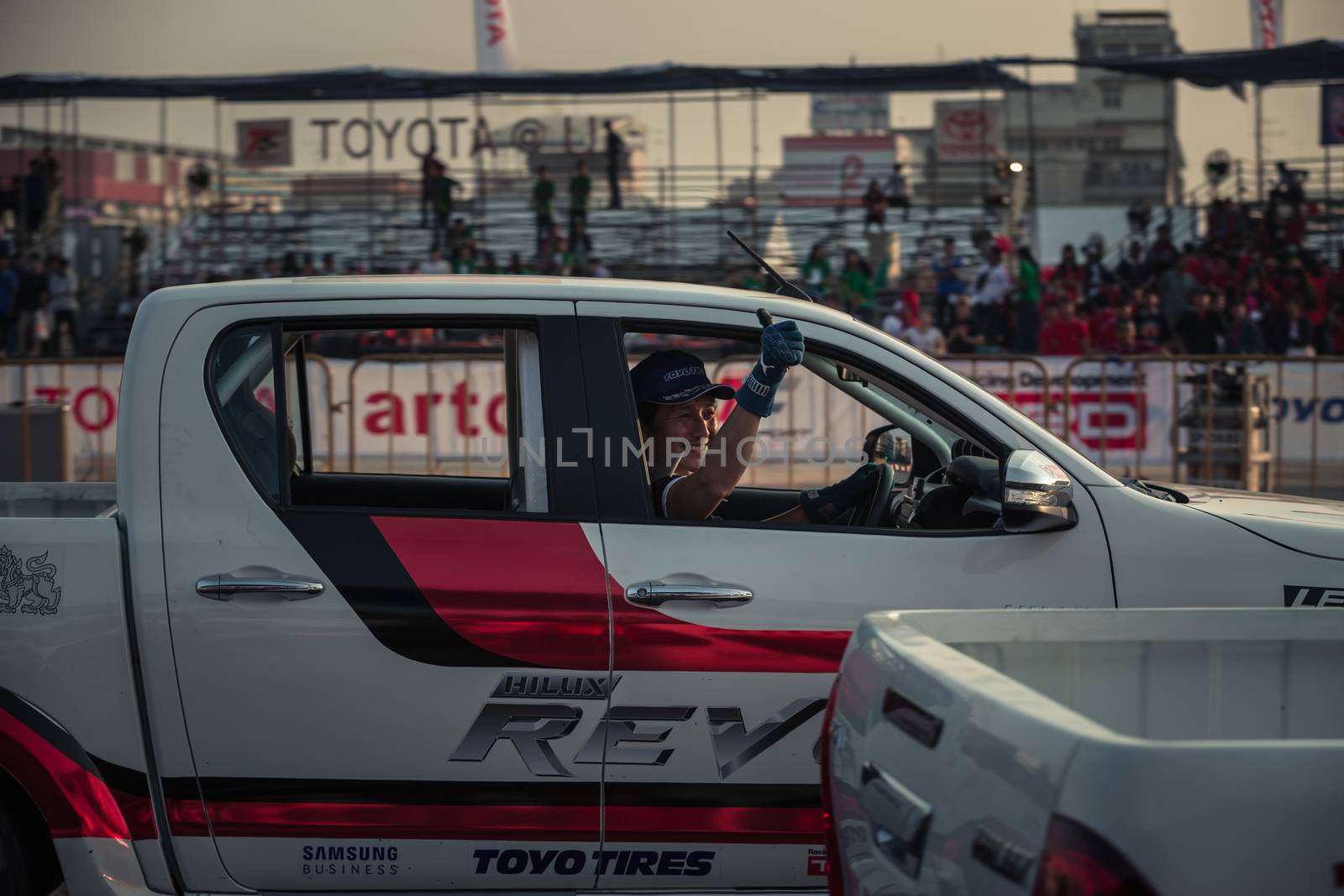 Udon Thani, Thailand - October 18, 2015: Masato Kawabata Japanese driver of the Toyota Hilux Revo thumb up to the audiences after drifting contest on the track between driver from Thailand and Japan at the event Toyota Motor Sport show at Udon Thani, Thailand