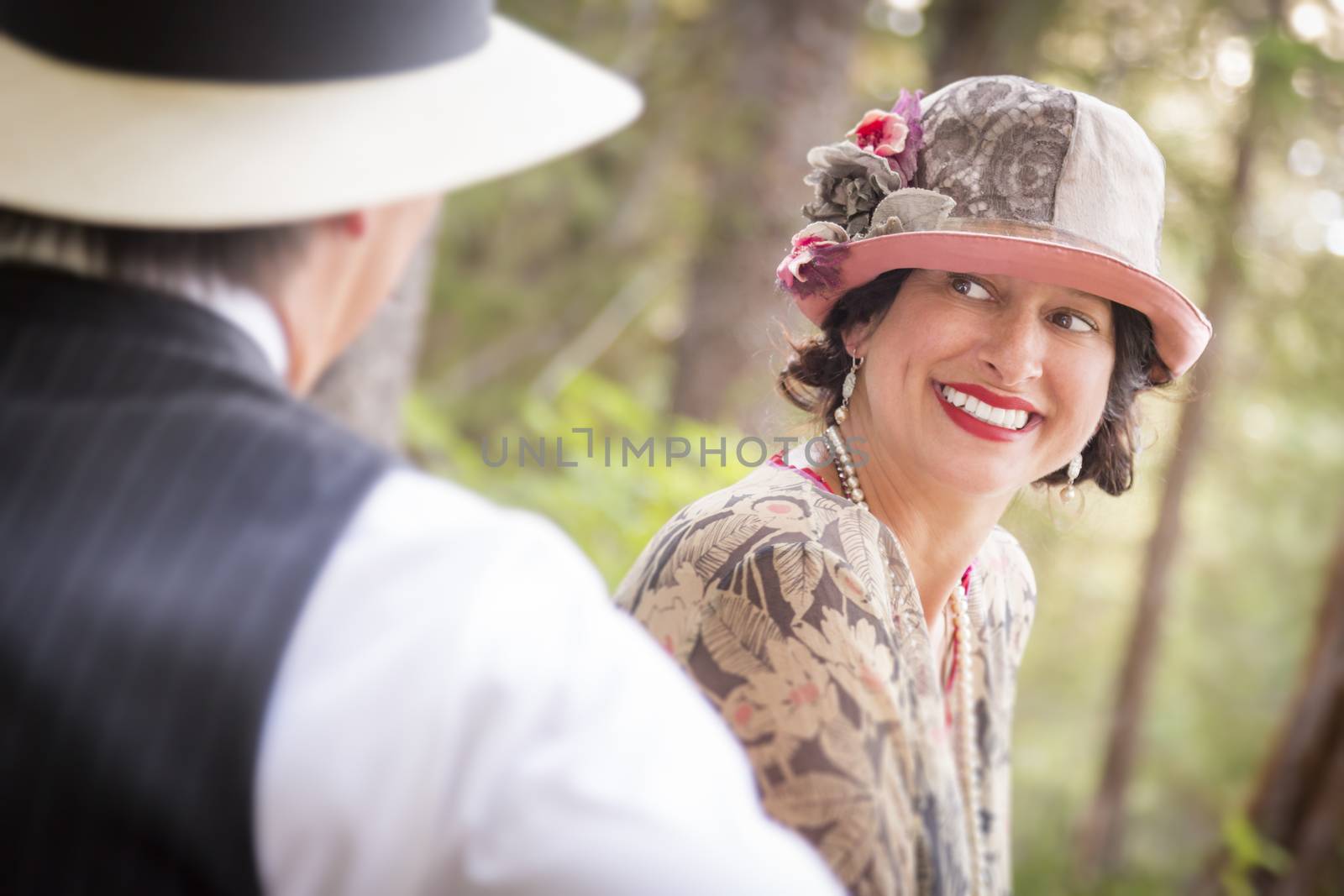 Attractive 1920s Dressed Romantic Couple Flirting Outdoors.