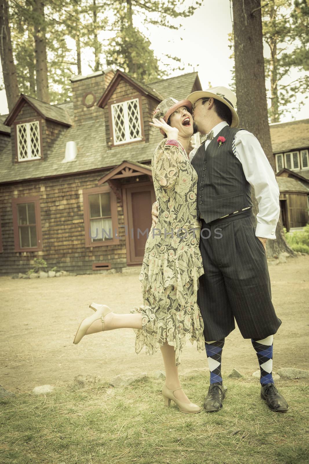 1920s Dressed Romantic Couple in Front of Old Cabin by Feverpitched
