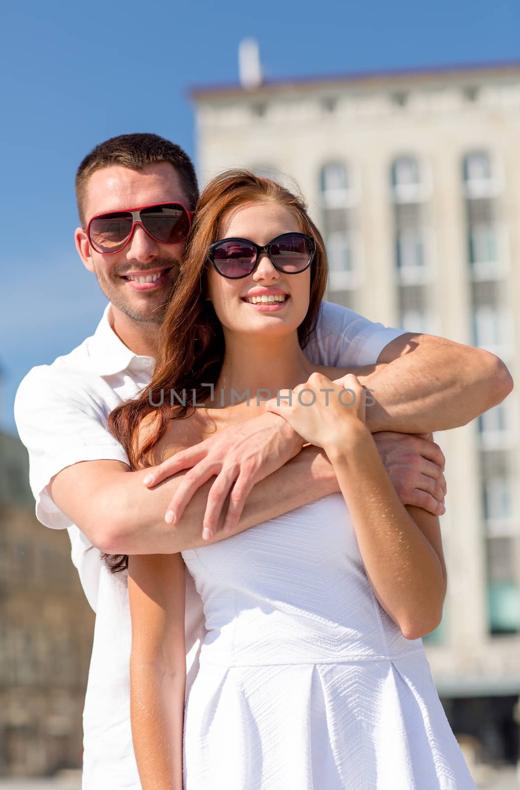 smiling couple in city by dolgachov