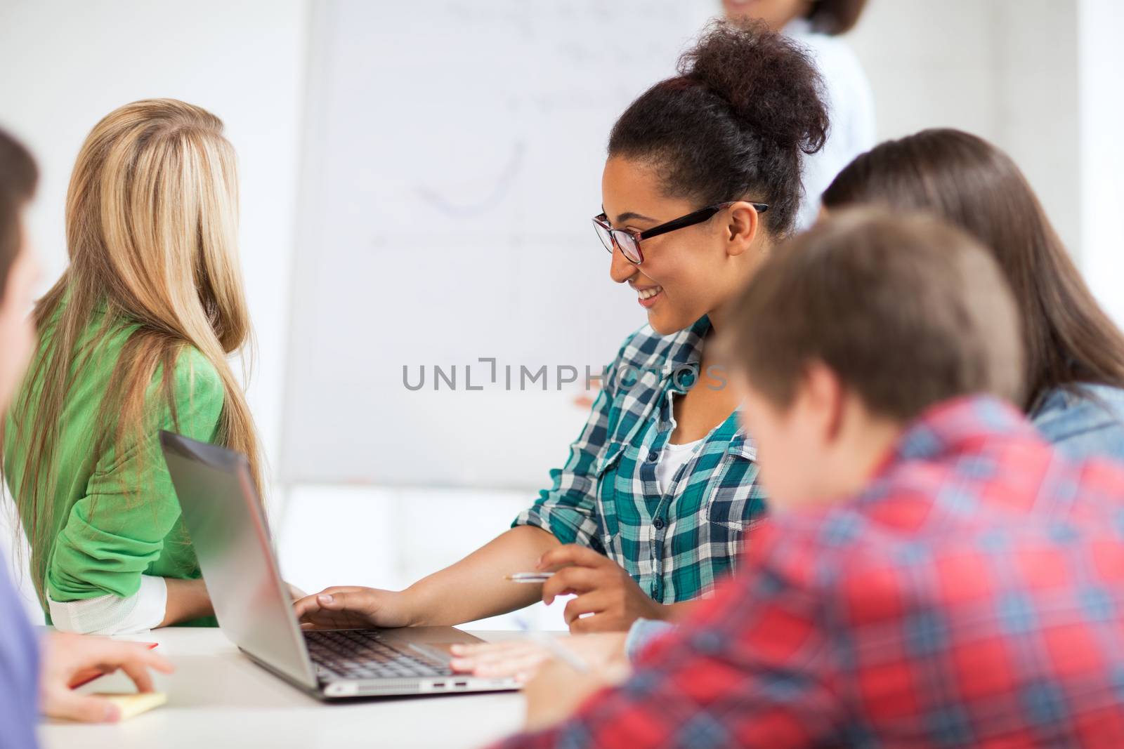 education and internet - african student girl with laptop at school