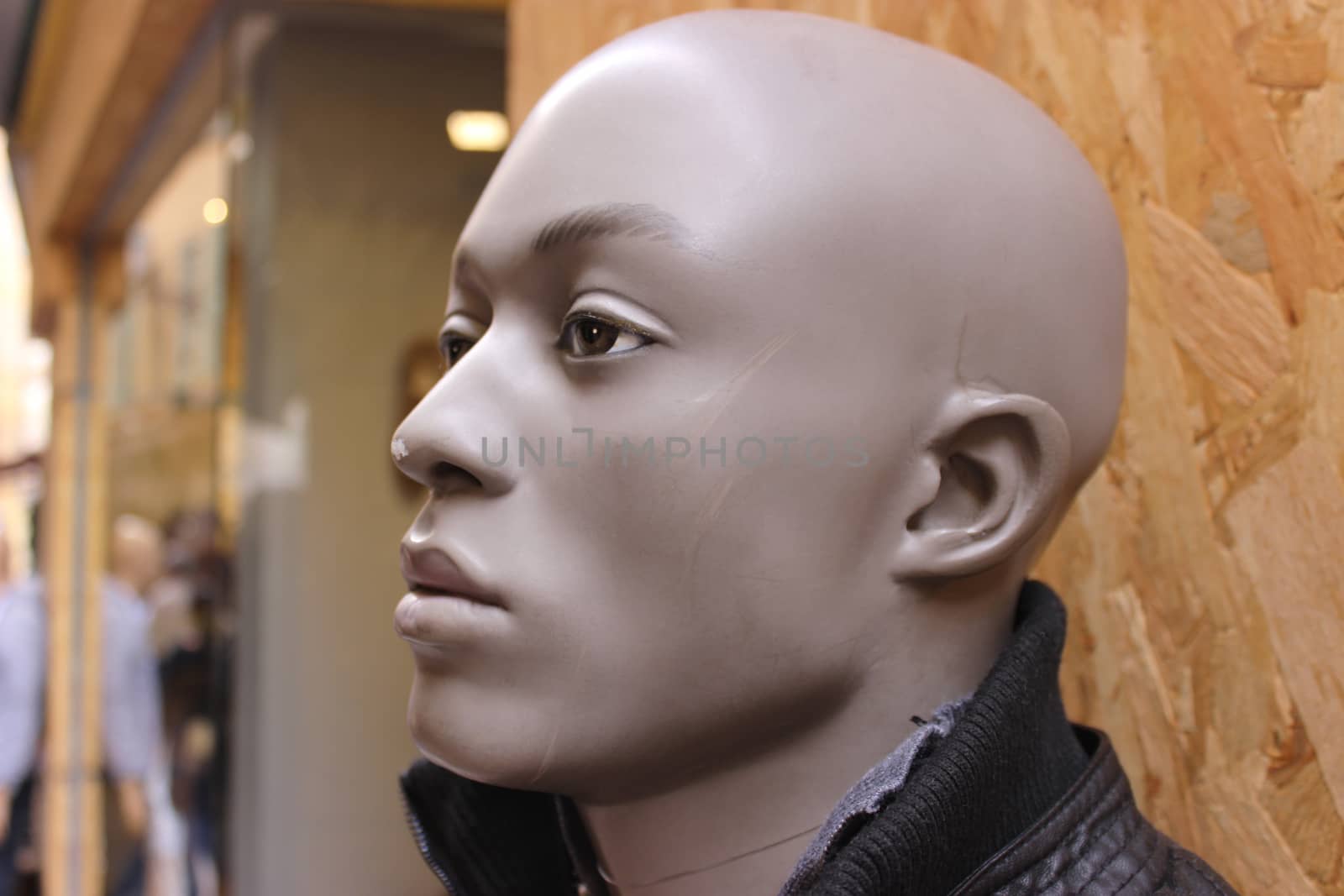 Black Male Mannequin in front of a store window