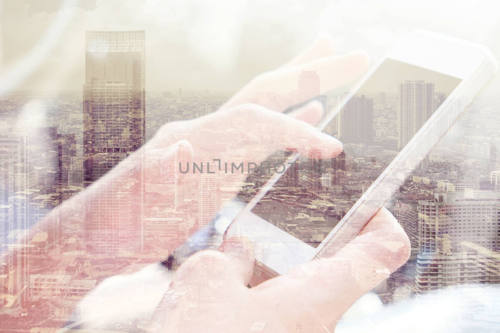 Double exposure of smart phone and cityscape background, communication technology concept