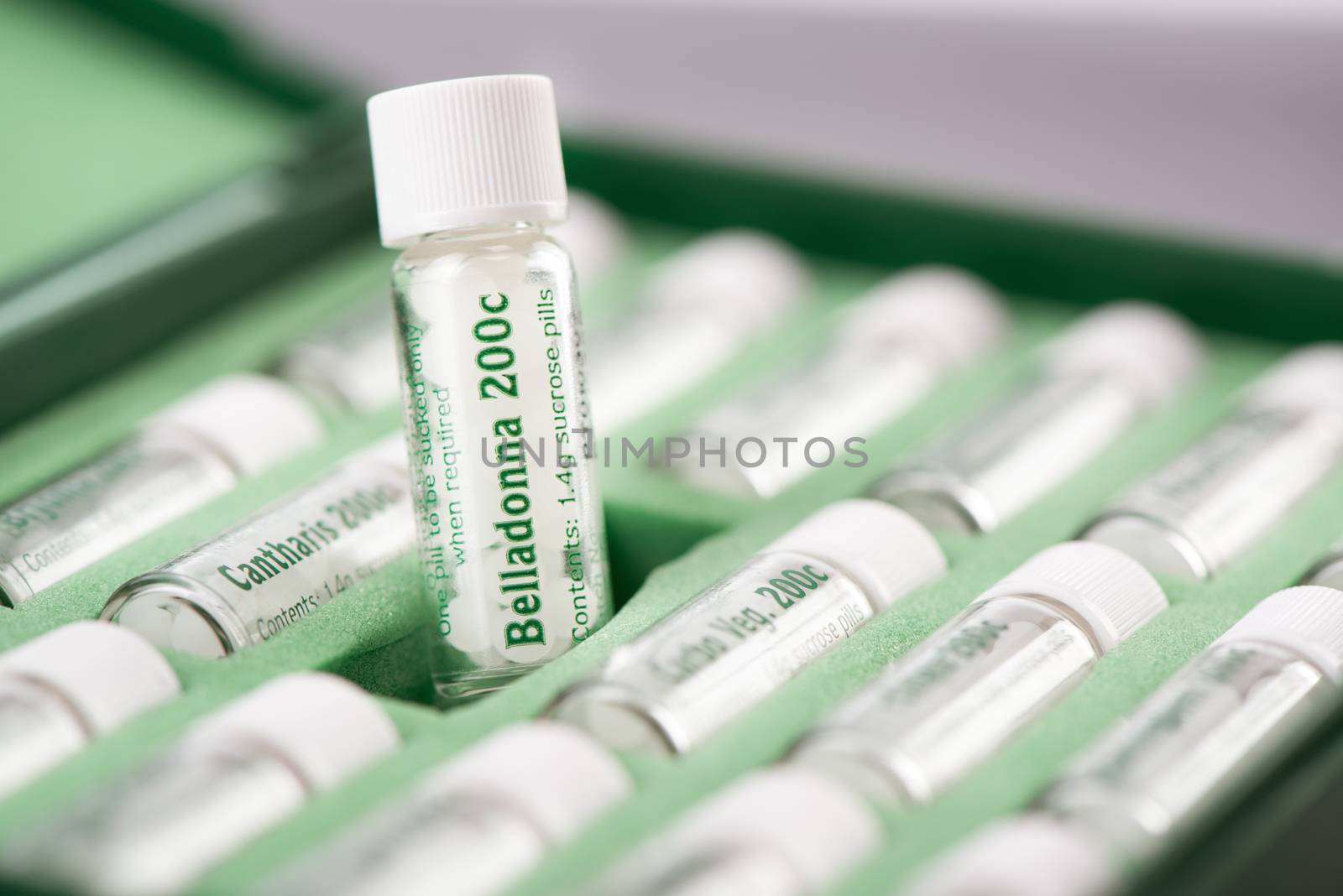 Closeup of bottles with homeopathic remedies. Belladonna pills.