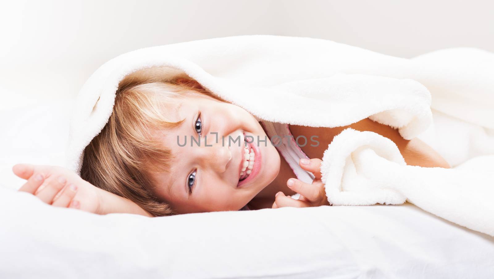 Cute little girl in the bed.