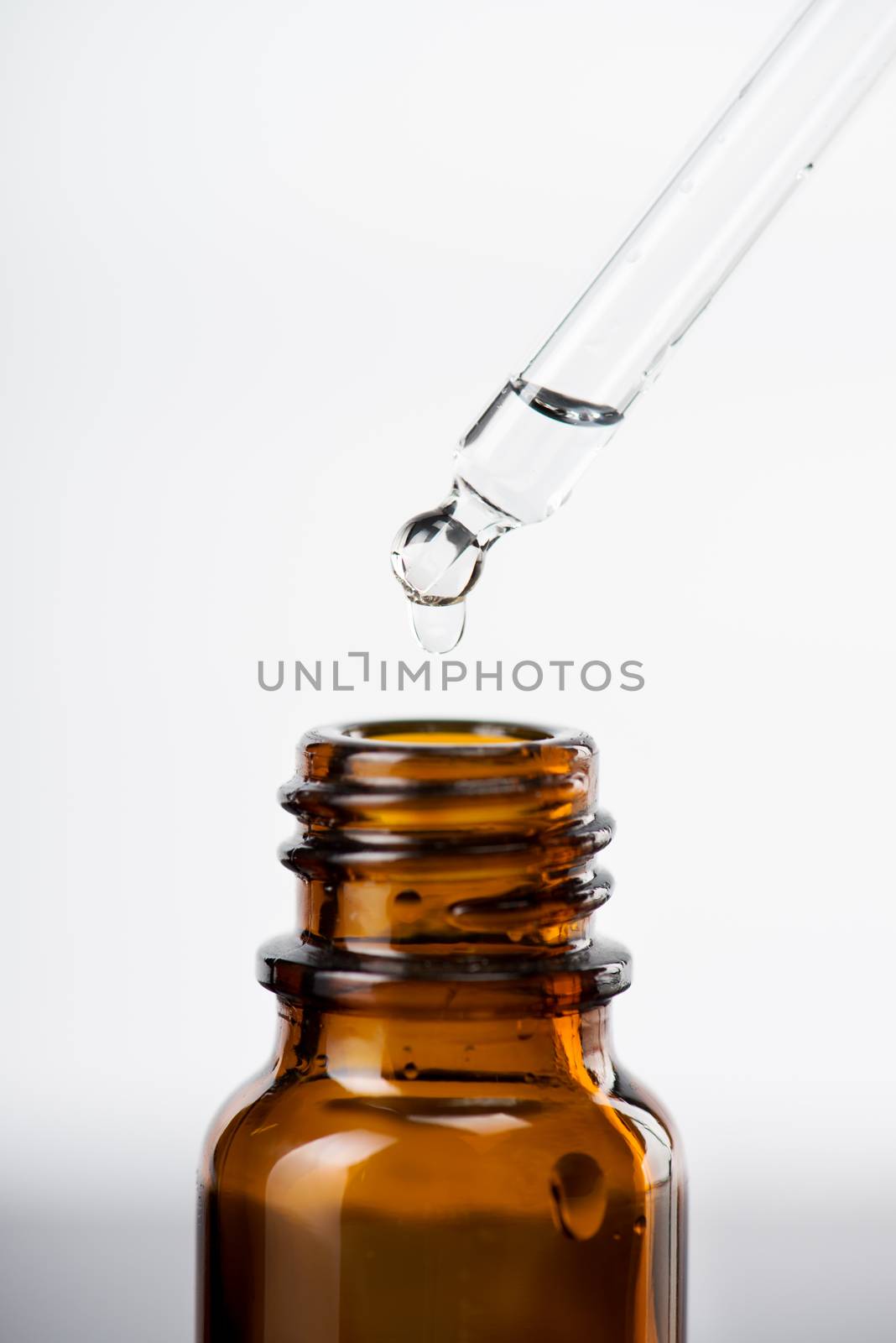 Brown glass bottles with drops Essential liquid in dropper.