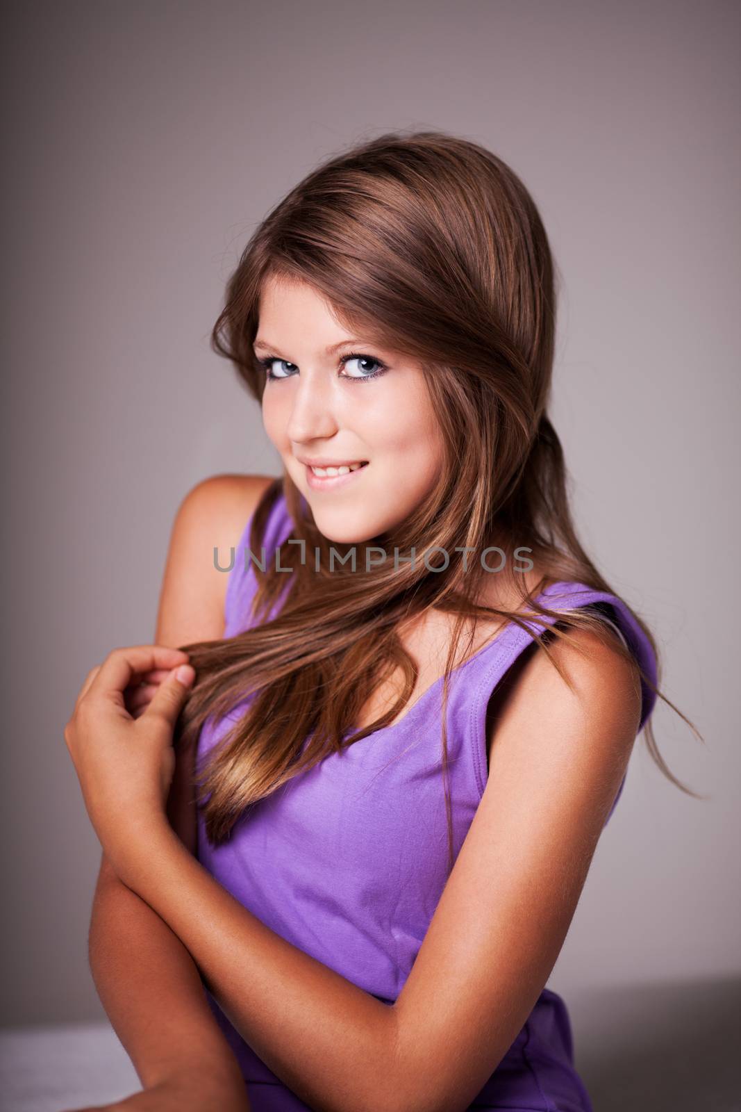 Beautiful teenage girl portrait, looking at camera.