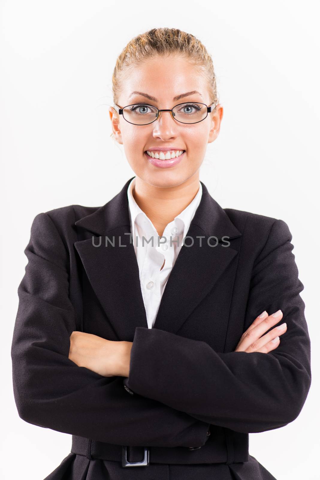 Portrait of attractive businesswoman with arms crossed. Looking at camera.