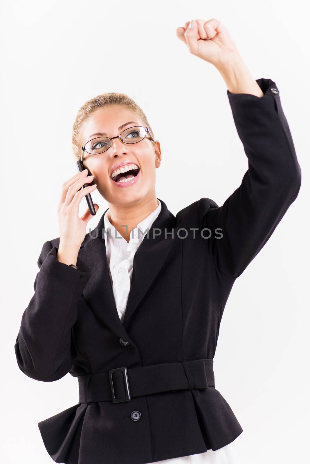Portrait of attractive successful businesswoman using a mobile phone. She is happy.