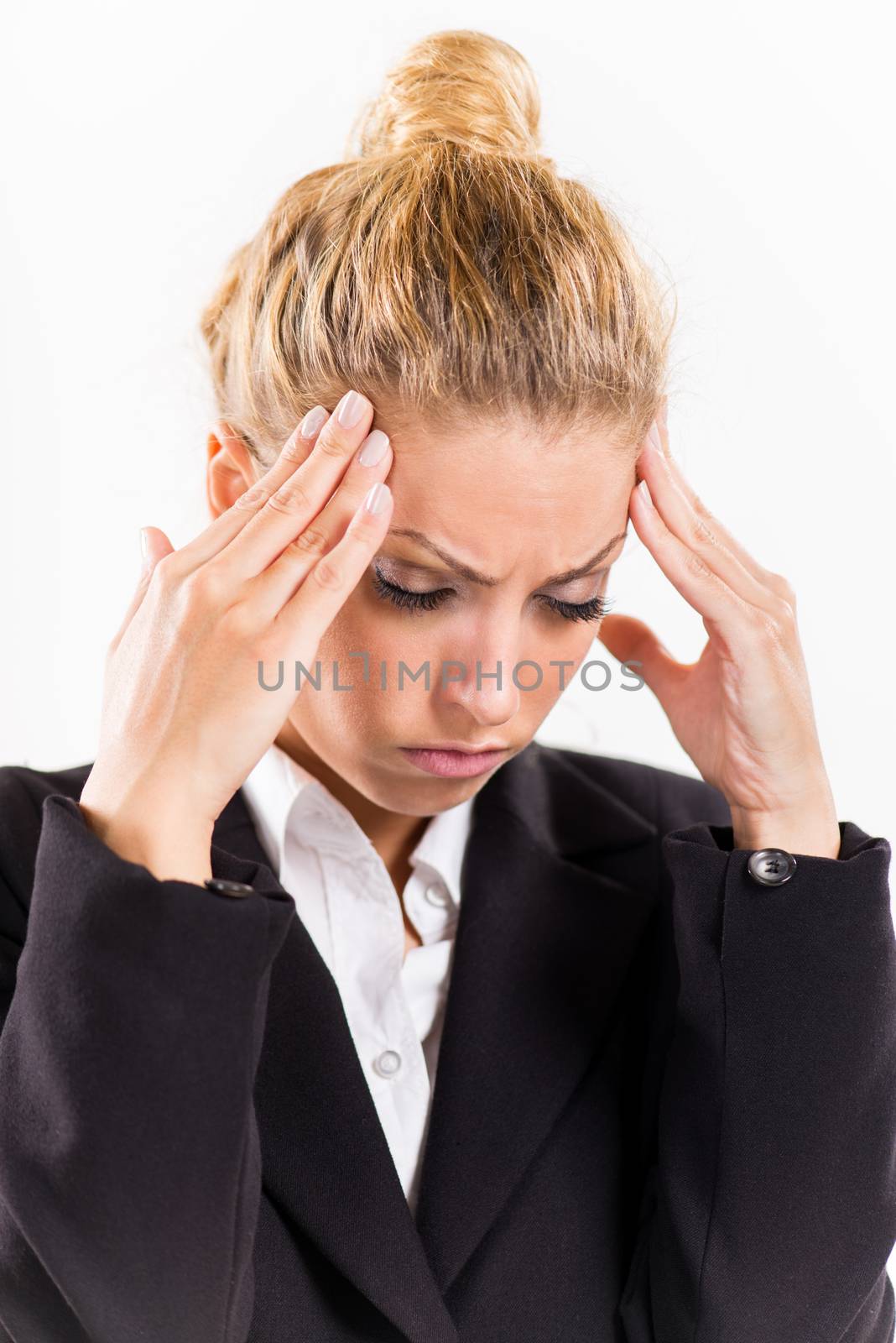 Portrait of attractive businesswoman with a headache.