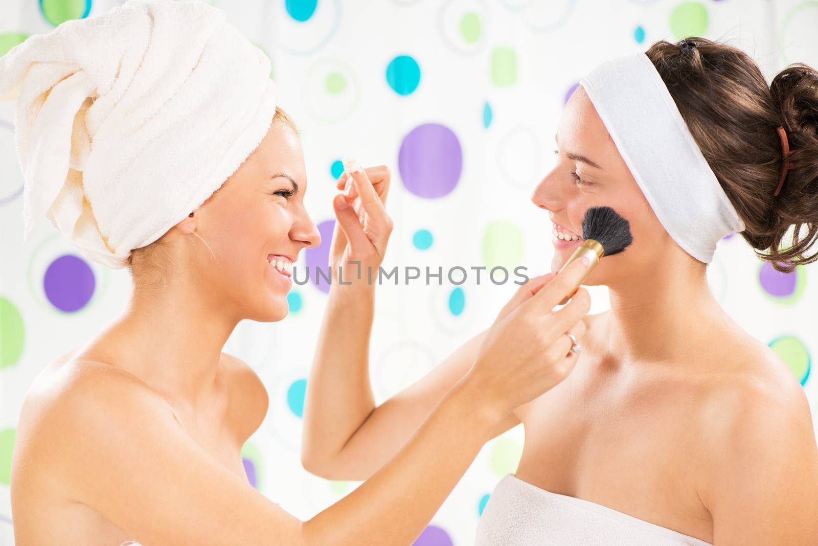 Two young cute woman having fun and get ready to start their day.