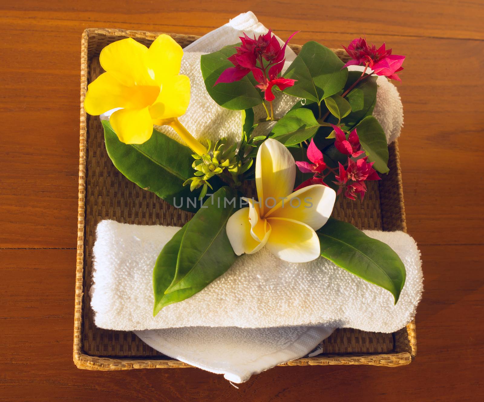 Towels and red, yelow and white flowers