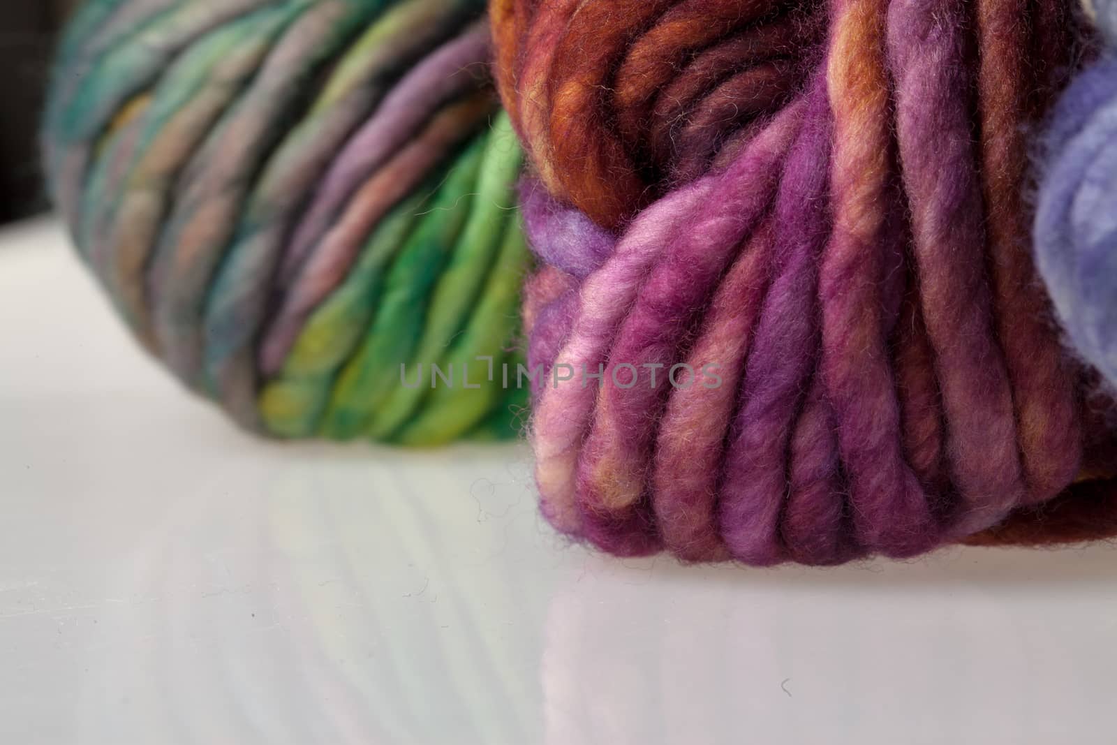 Set of colorful wool yarn balls. Closeup photo.