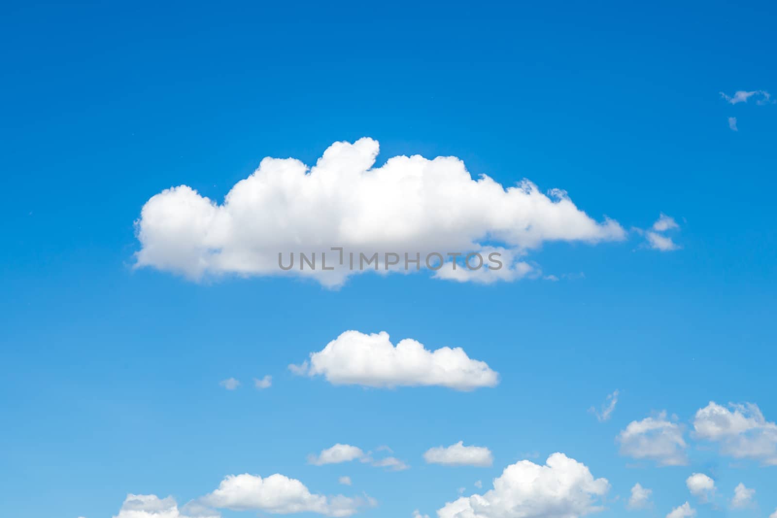 blue sky background with wave clouds by powerbeephoto