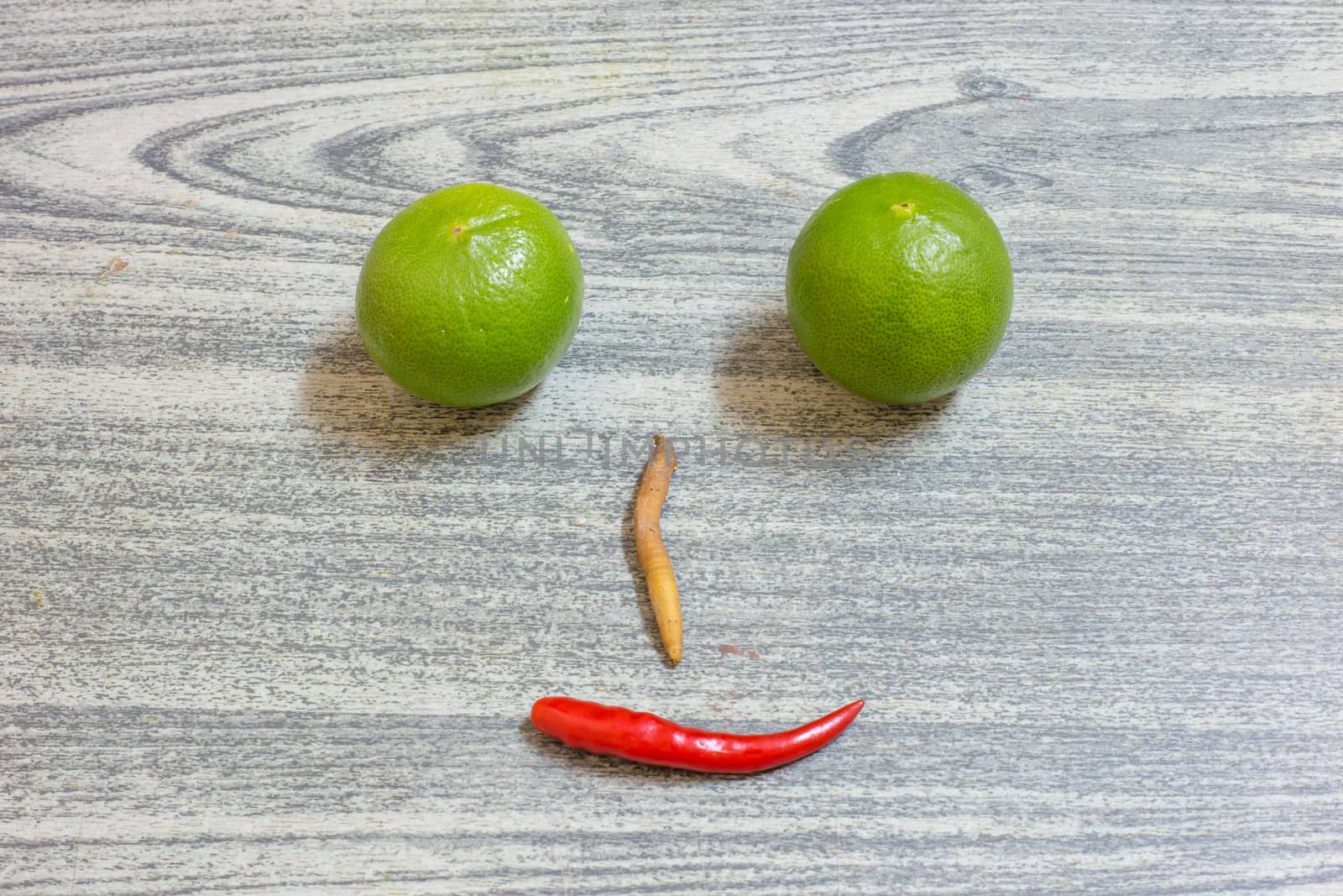 lemon red pepper fingerroot is face on wood background, herb set and spices