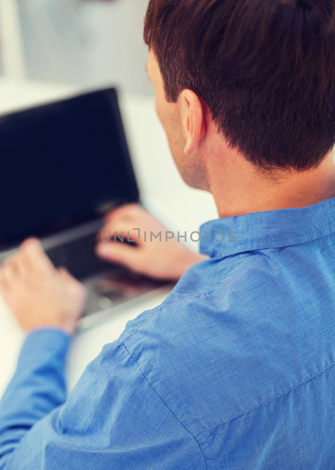 close up of man with laptop computer by dolgachov